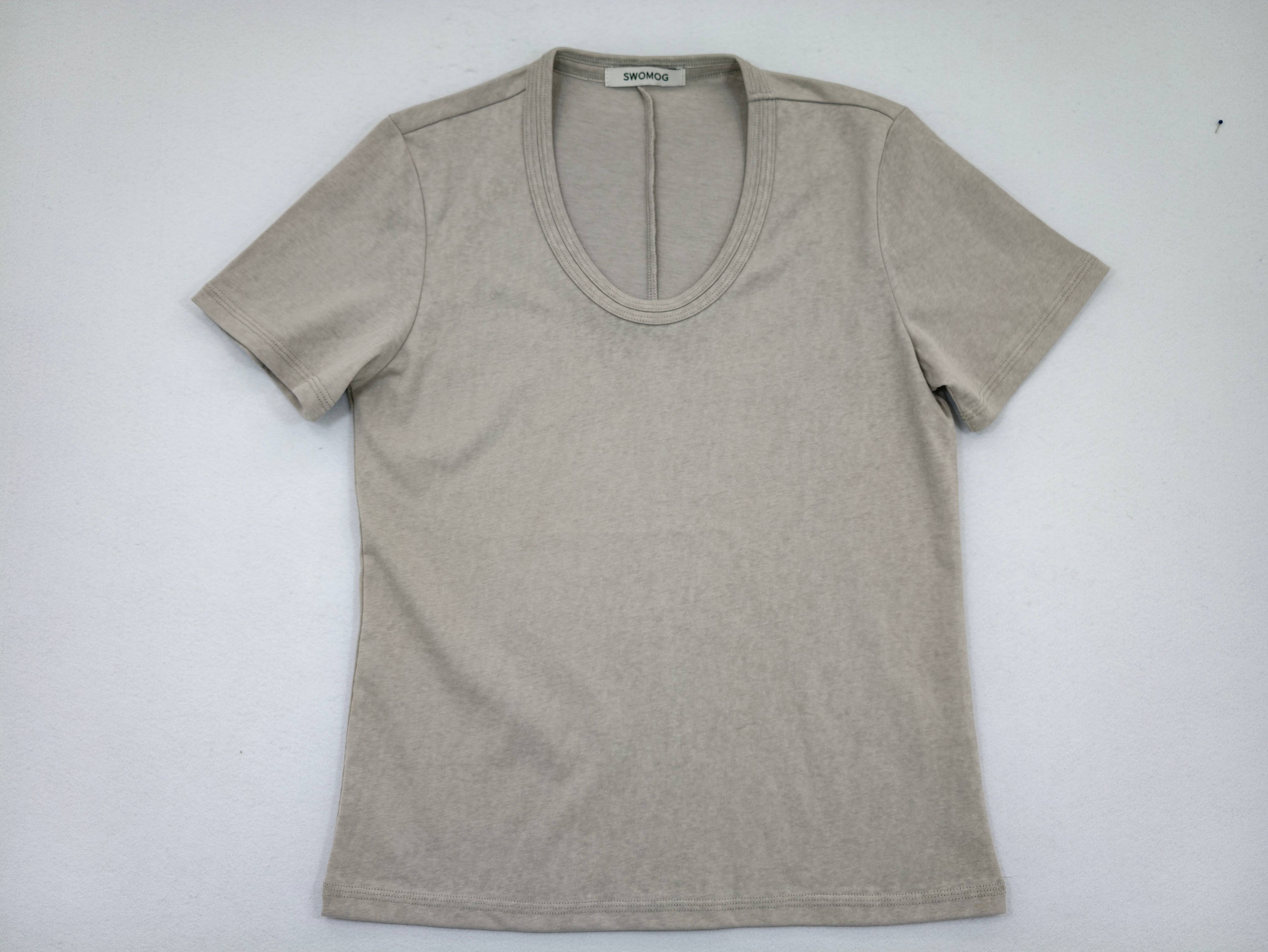 Cotton-blend fitted tee laid flat from front