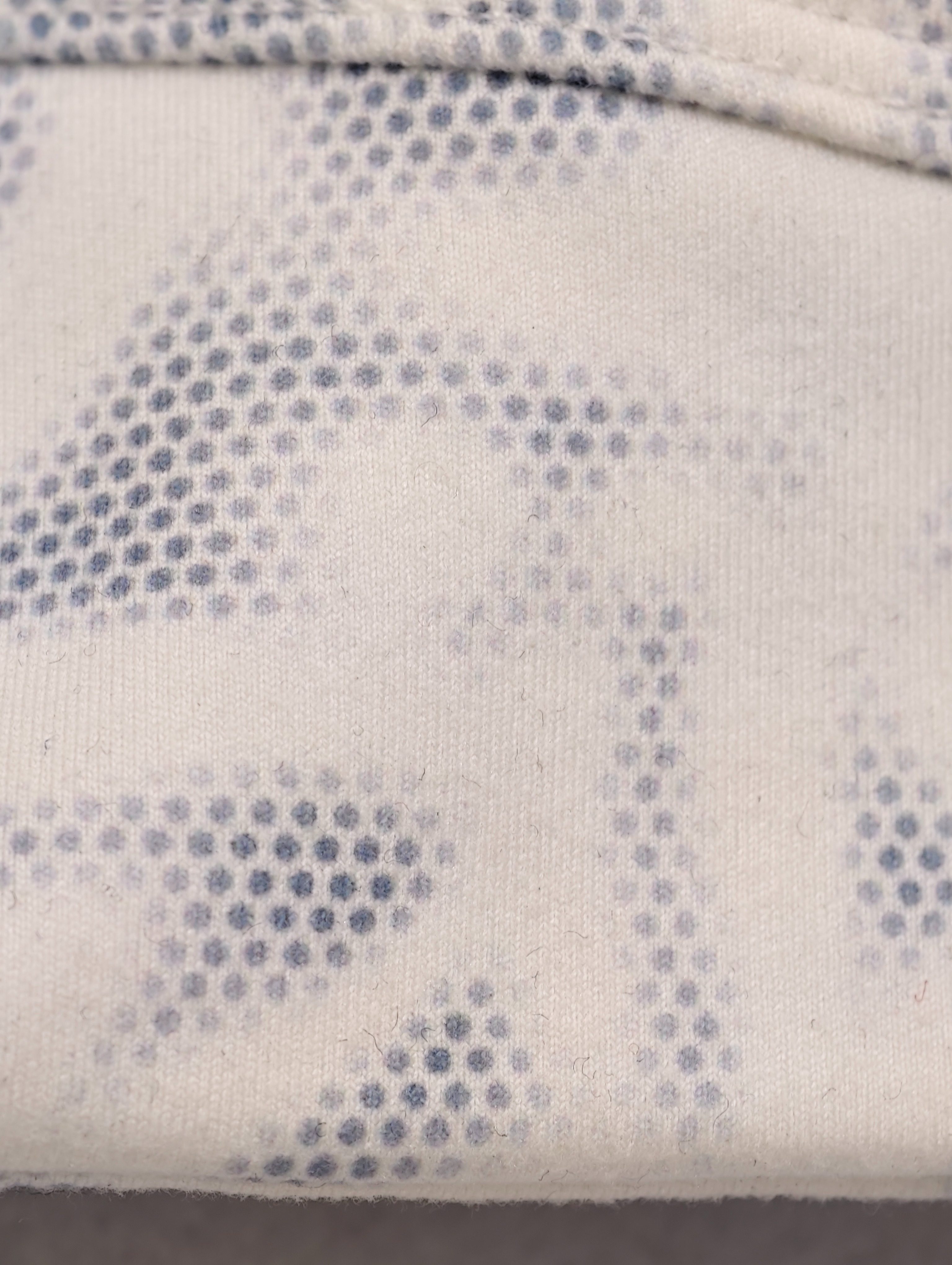 Close-up of light blue abstract print stretch fabric