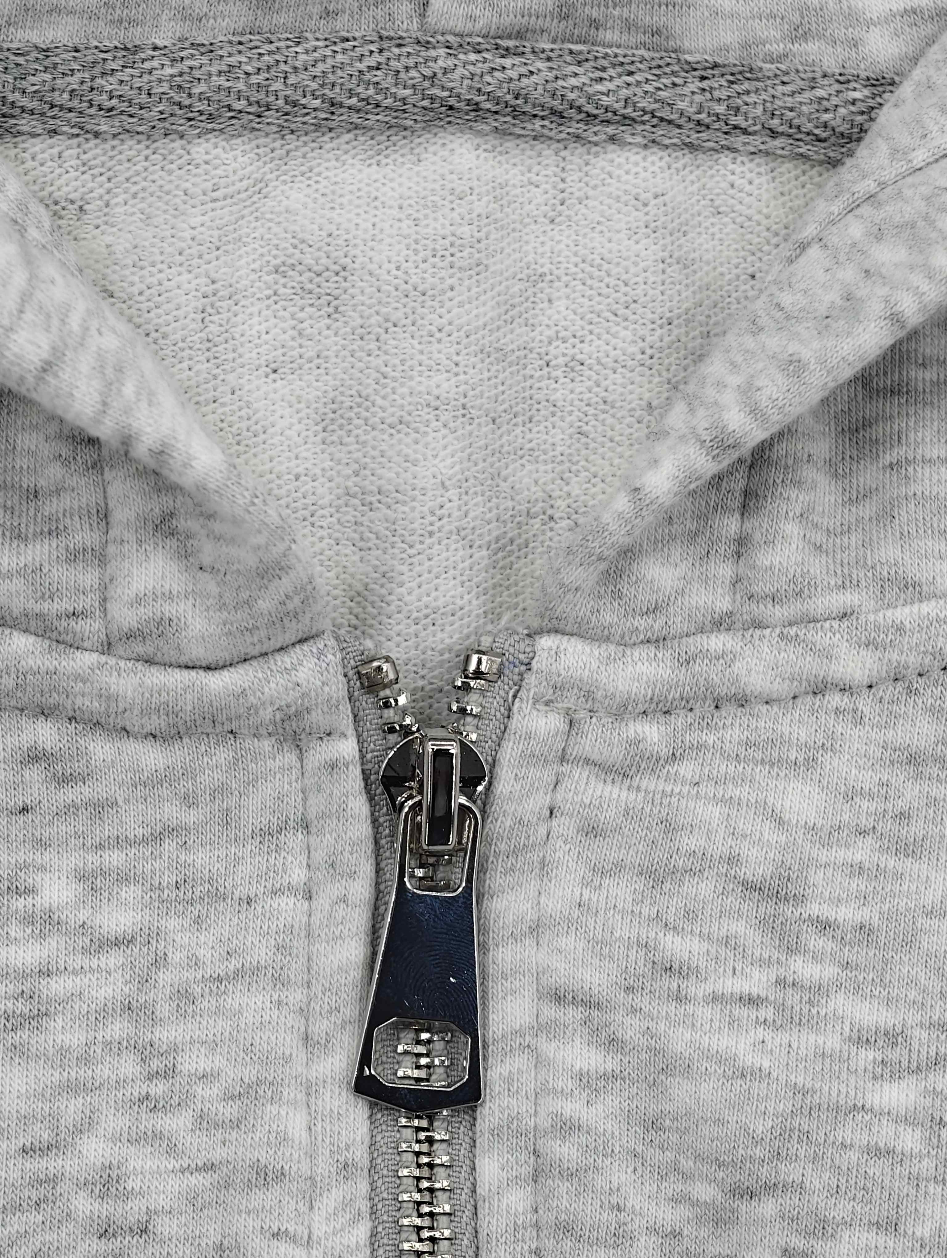 Attached hood and metal zipper fastening detail