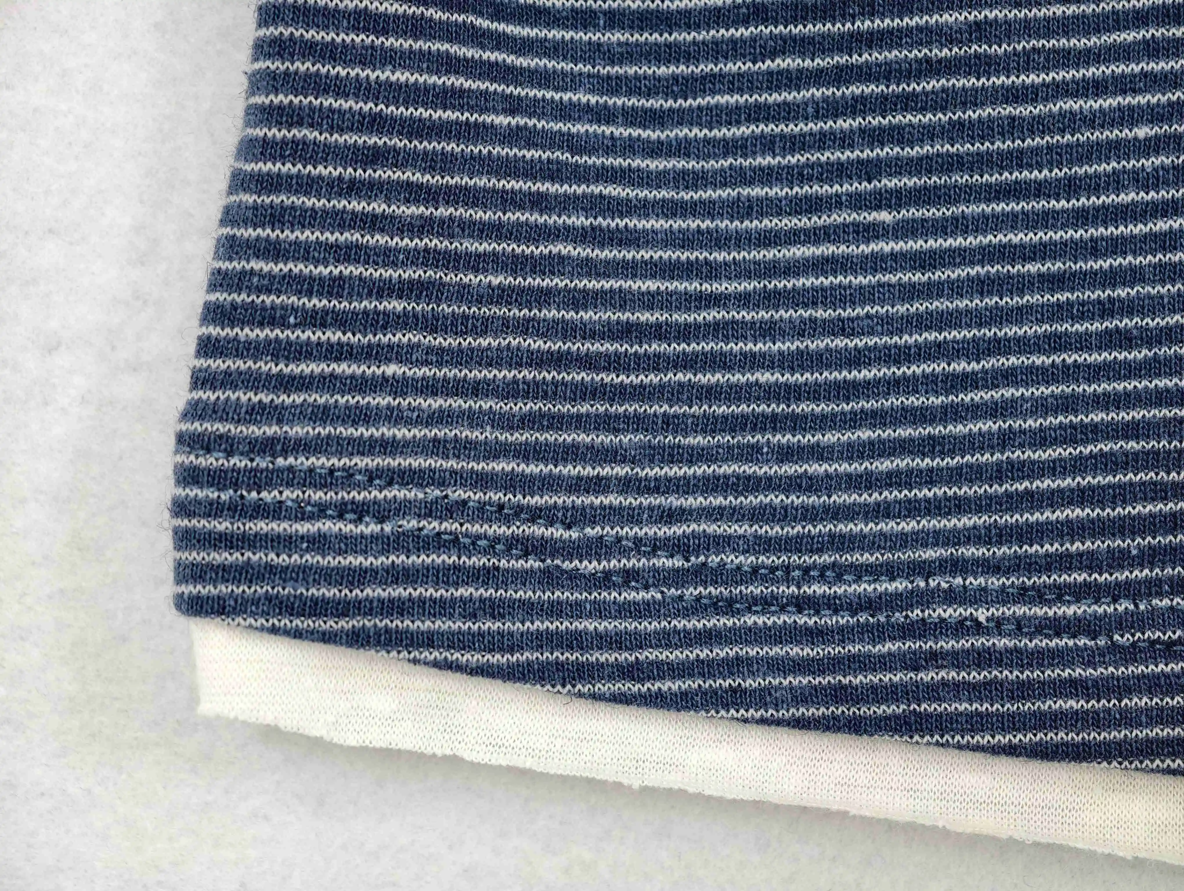 Fine linen-blend stripes above layered white hem
