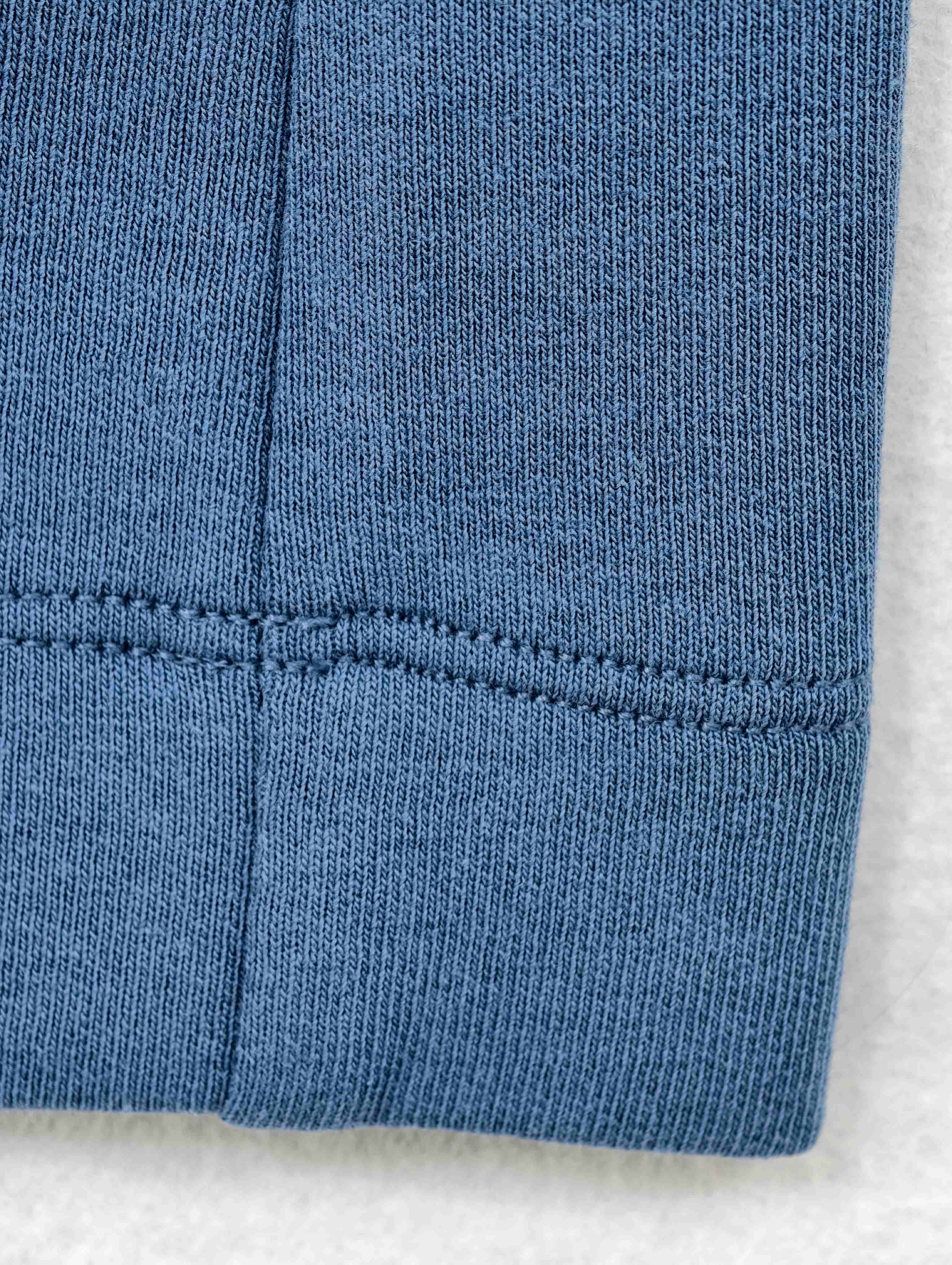Close-up of interlock fabric and hem stitching finish