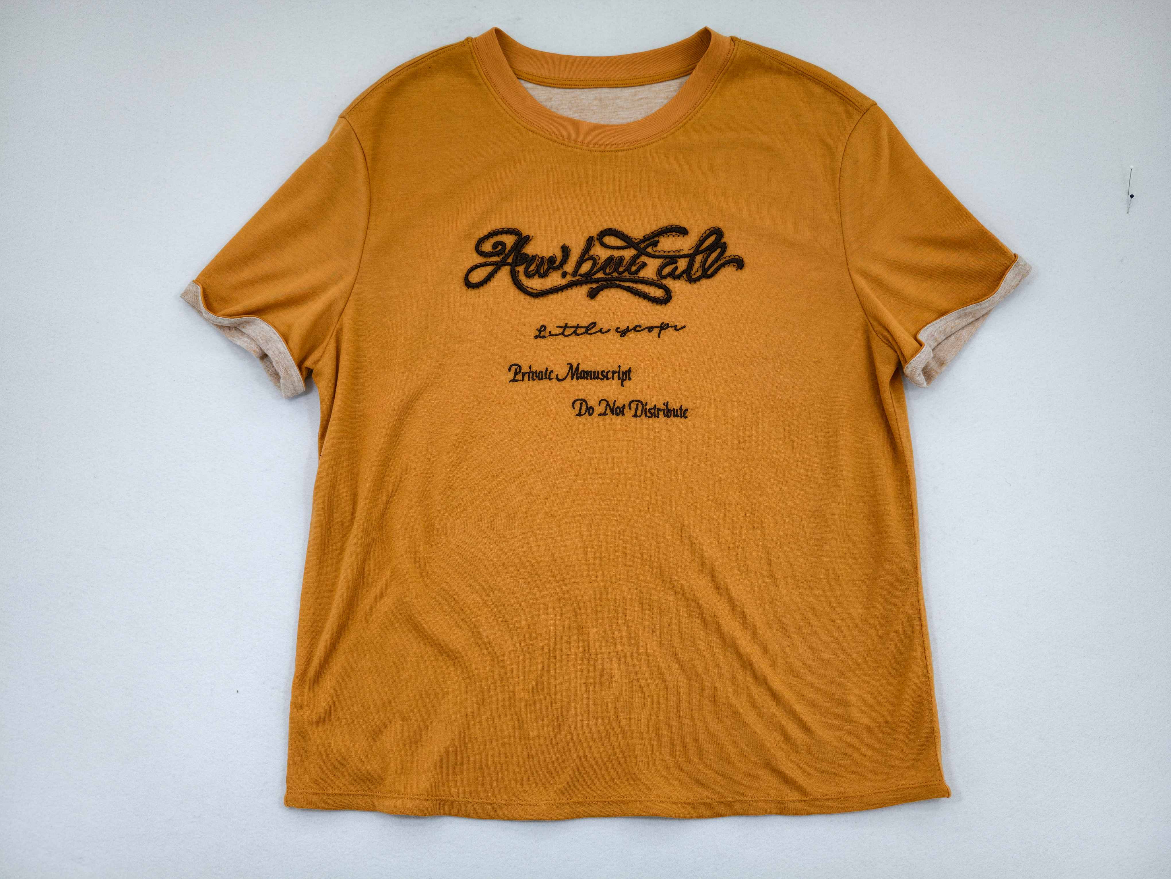 Ochre embroidered relaxed T-shirt laid flat from front