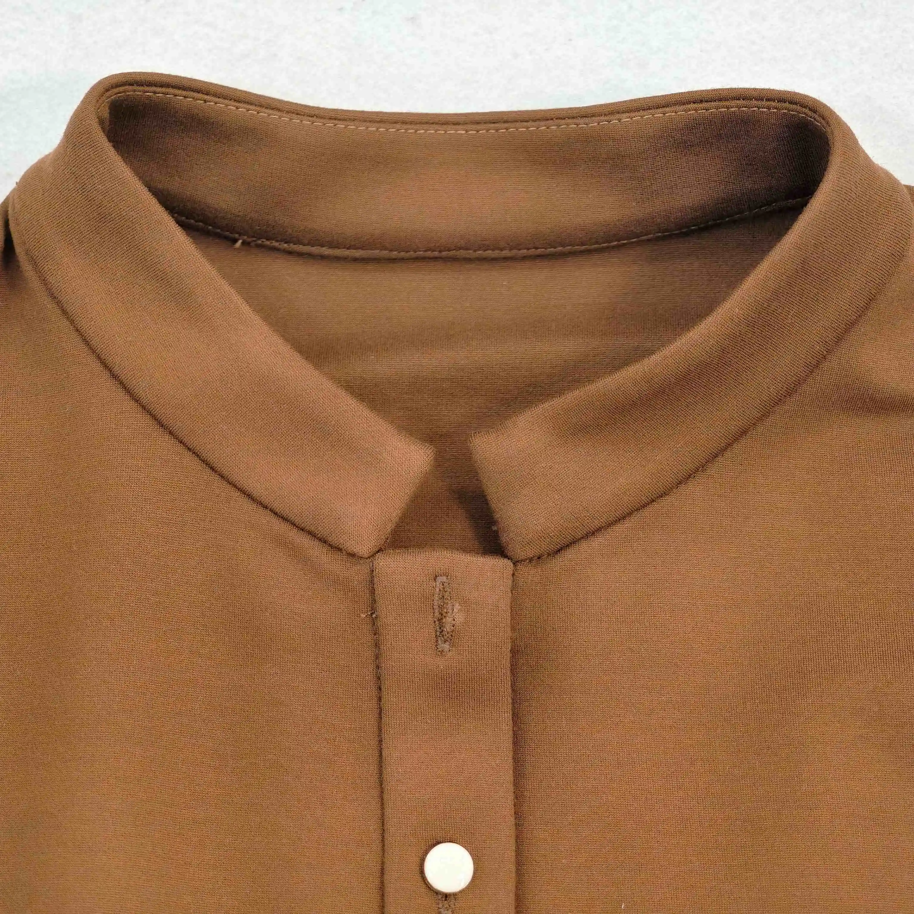 Stand collar construction in dense double-knit fabric