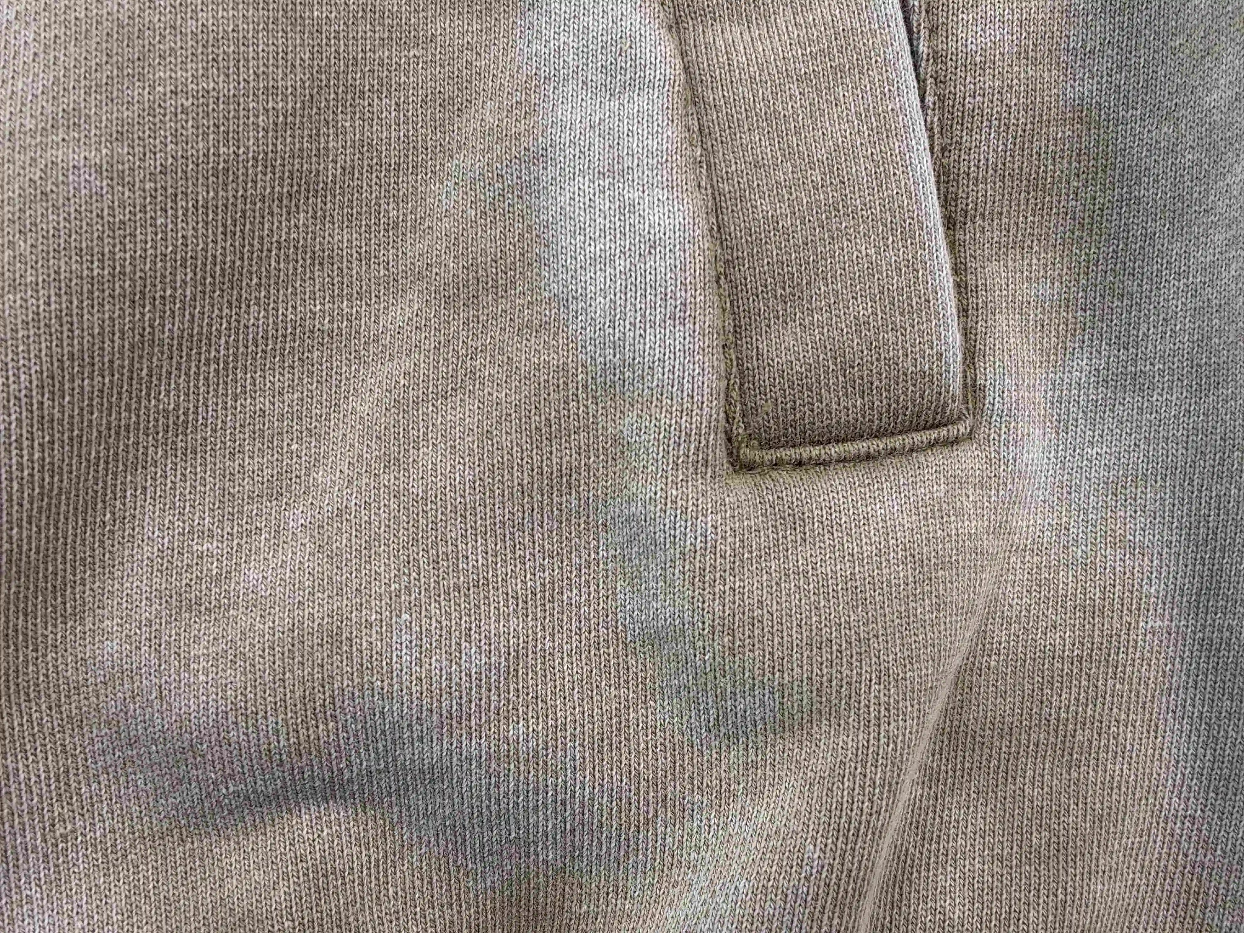 Vintage wash texture and pocket stitching close-up