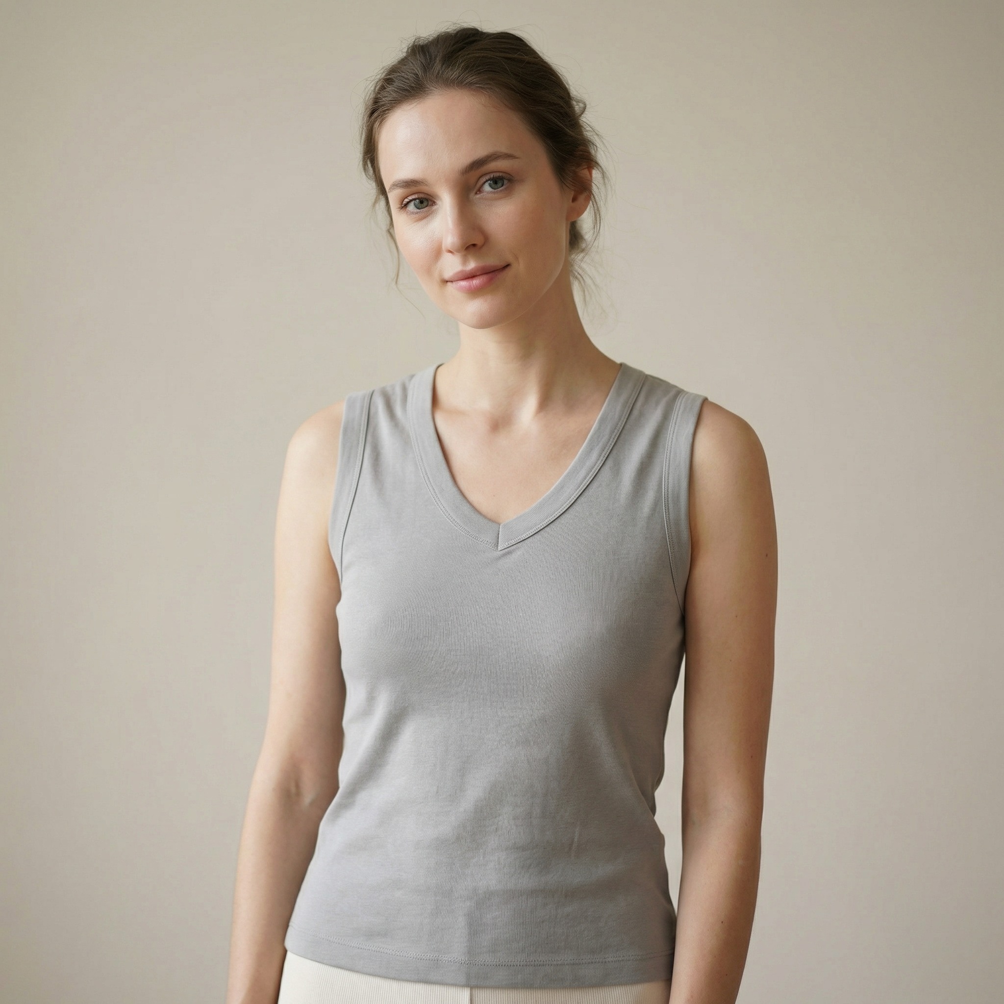Woman wearing grey V-neck lyocell-cotton sleeveless top