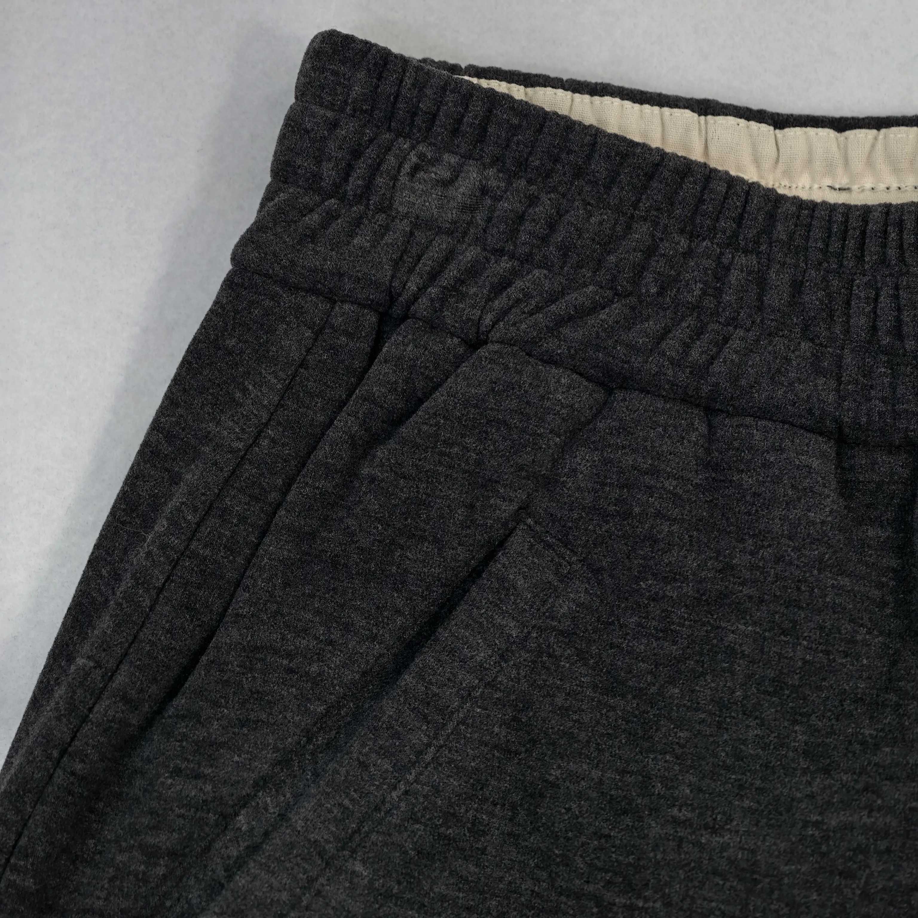 Elastic waistband and side pocket construction close-up