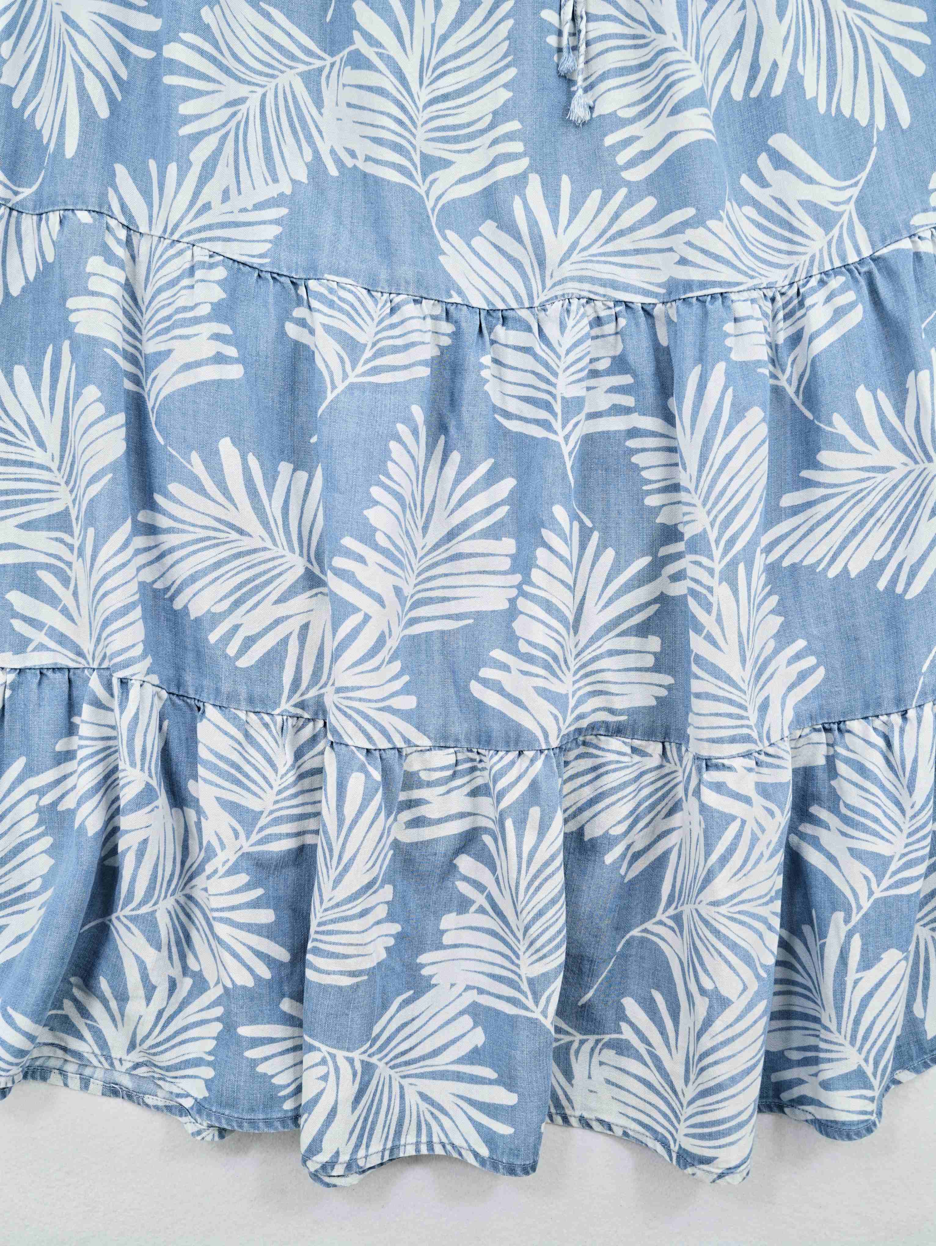 Multi-tier panels with white tropical leaf print