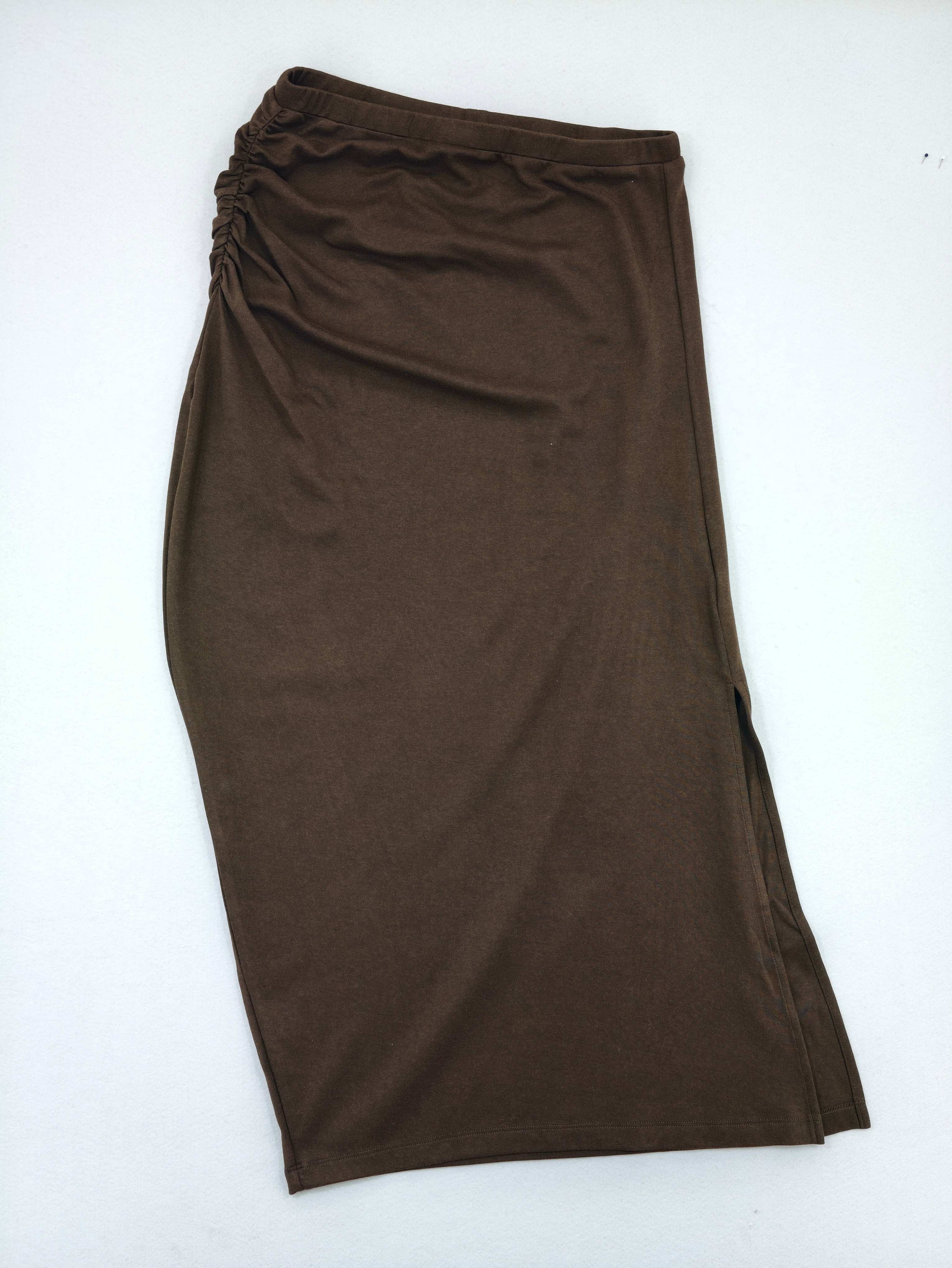 Back view of fitted stretch knit midi skirt
