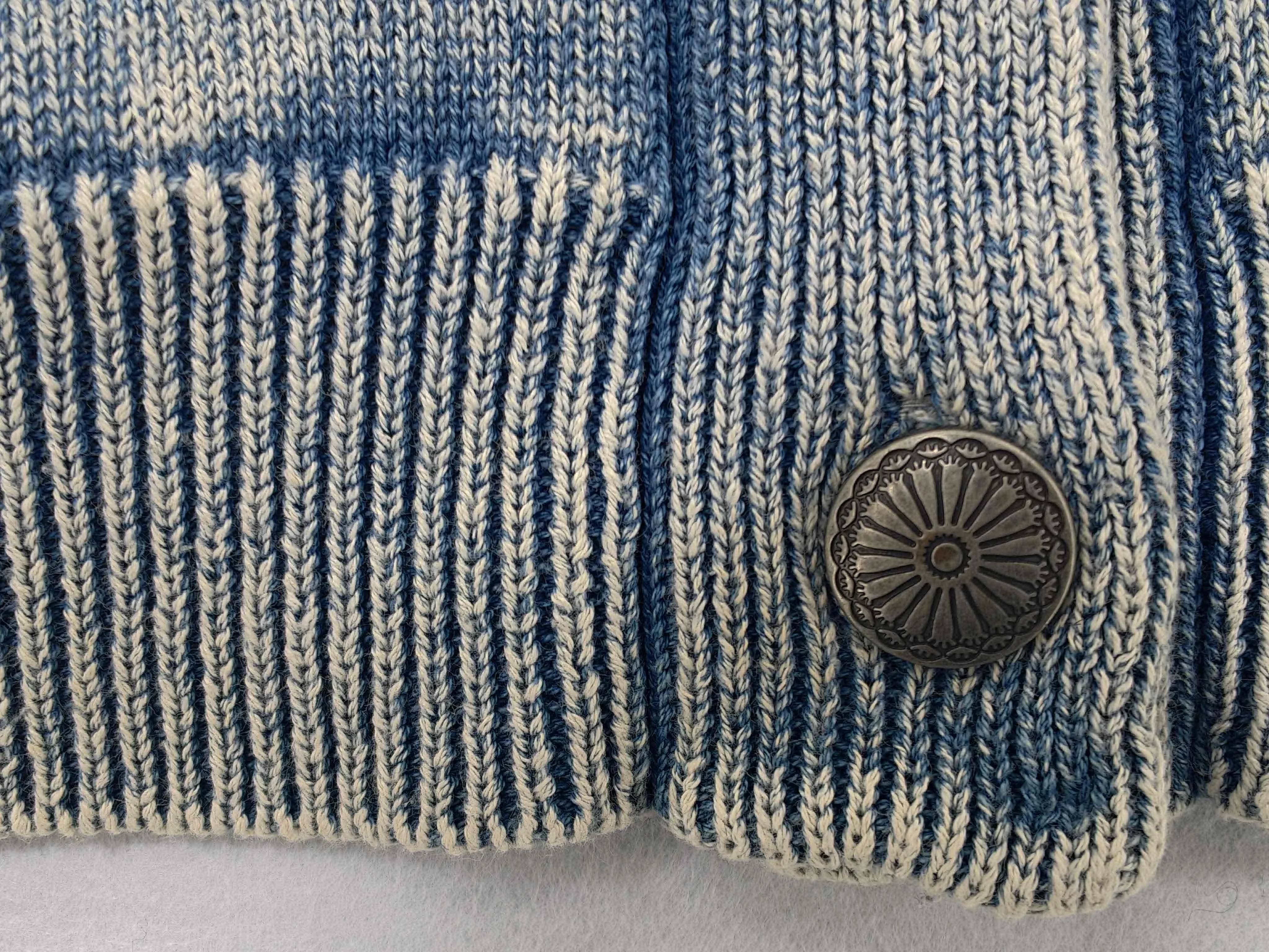 Ribbed placket with engraved metal button
