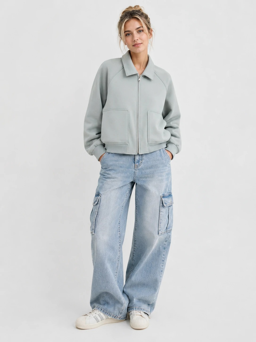 Woman wearing pale sage brushed-scuba zip-up jacket