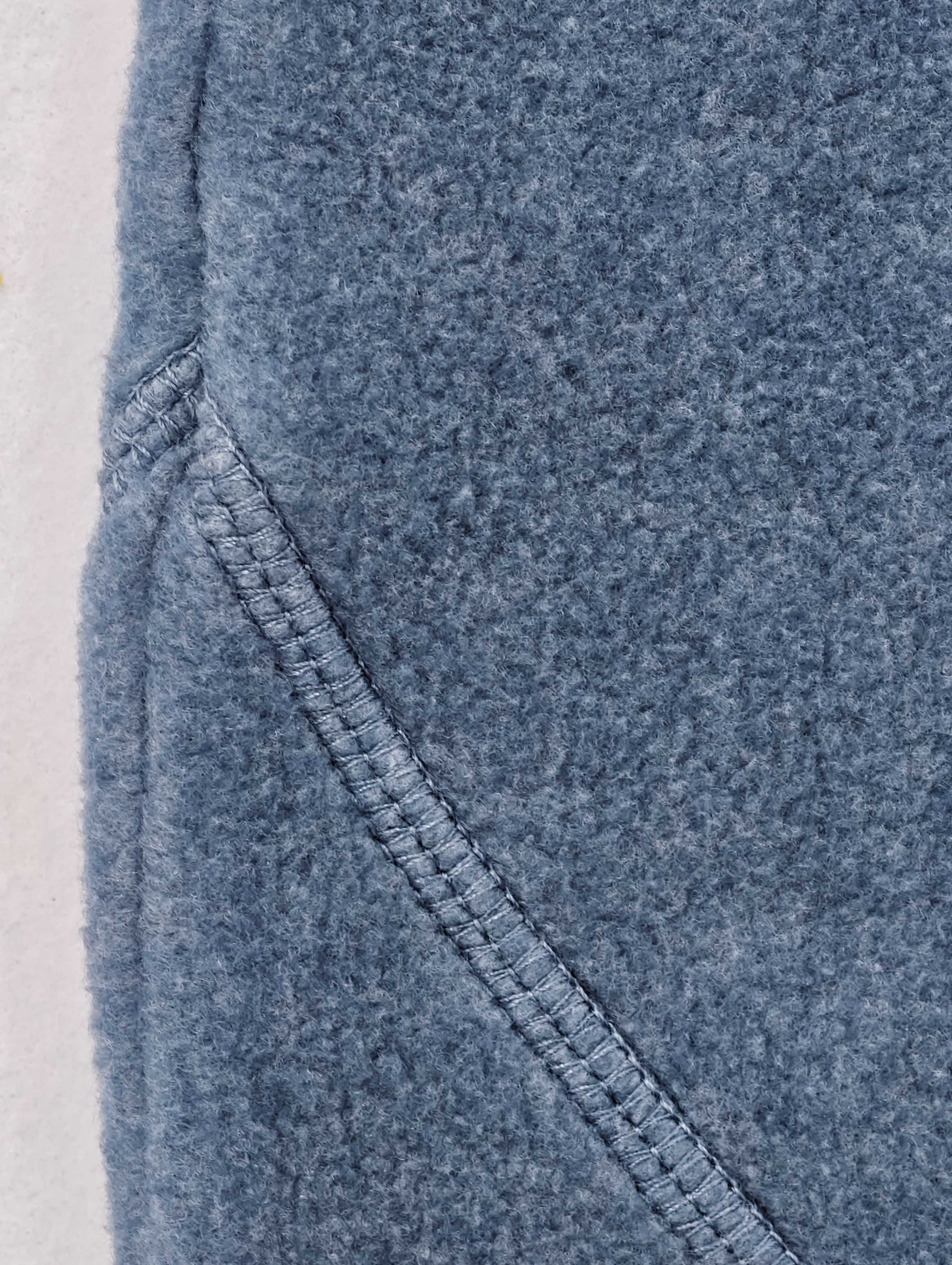 Curved lower-leg panel seam with reinforced stitching