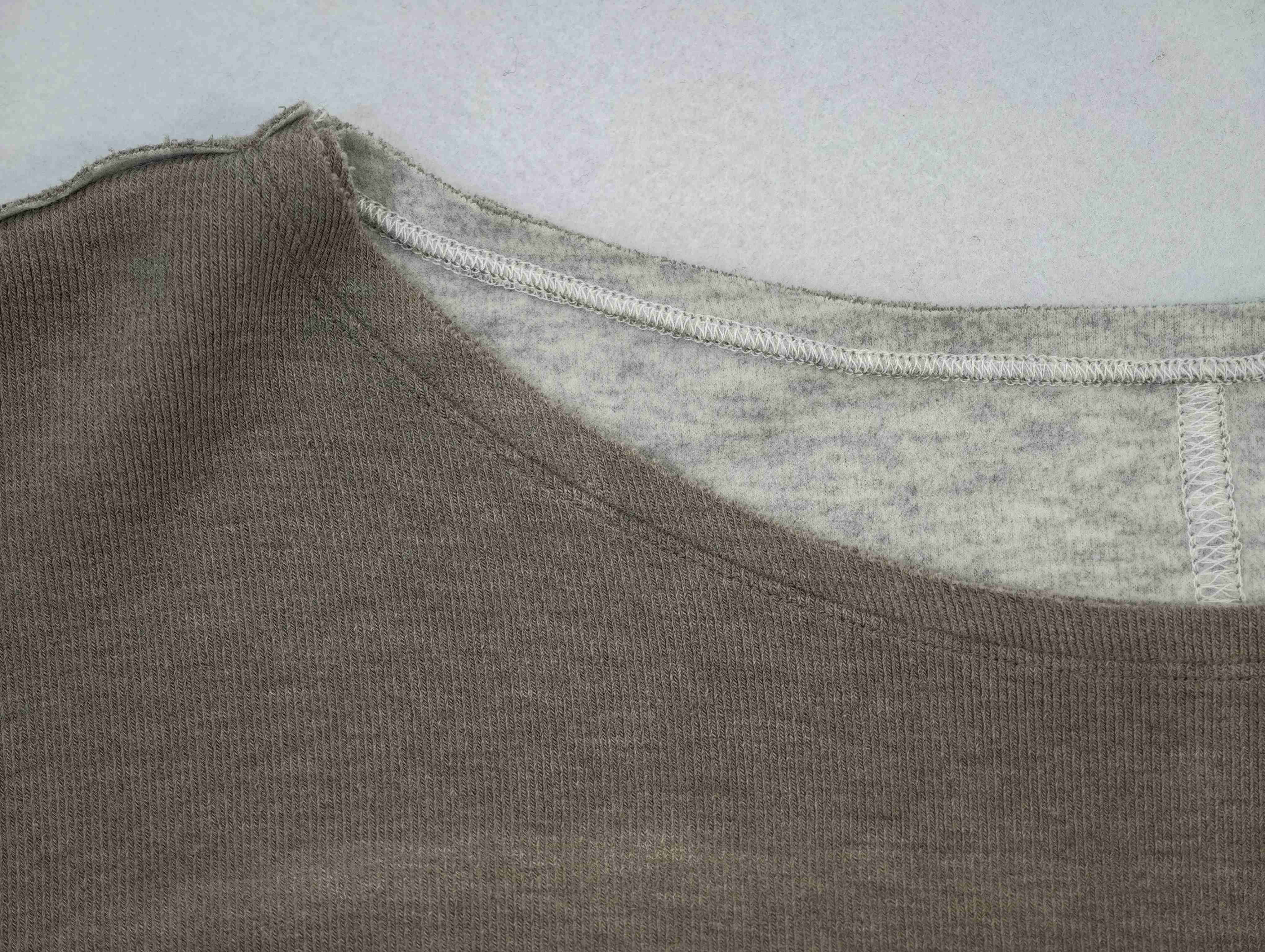 Wide neckline and rib binding construction close-up