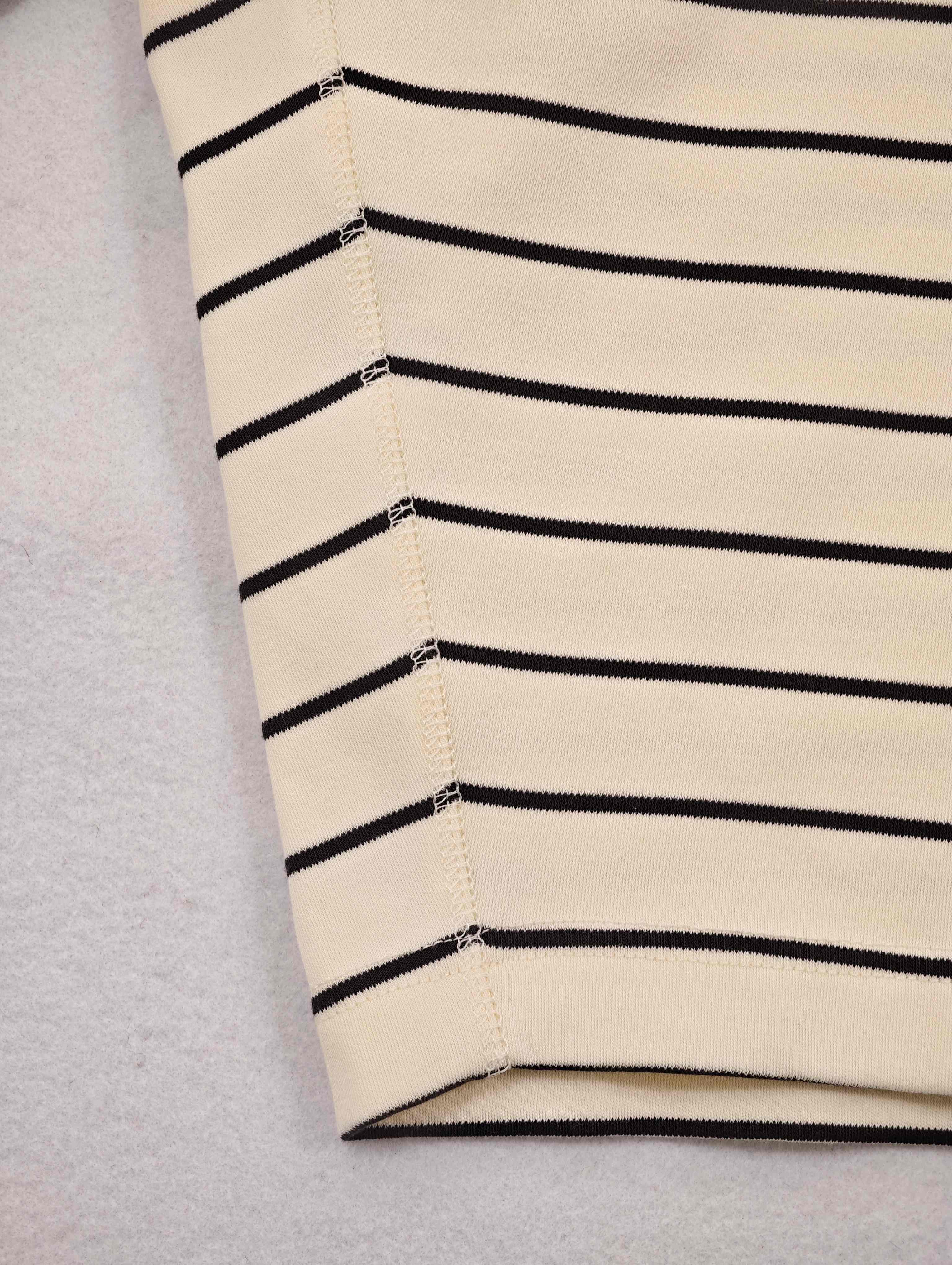 Raglan seam joining horizontal and vertical stripes