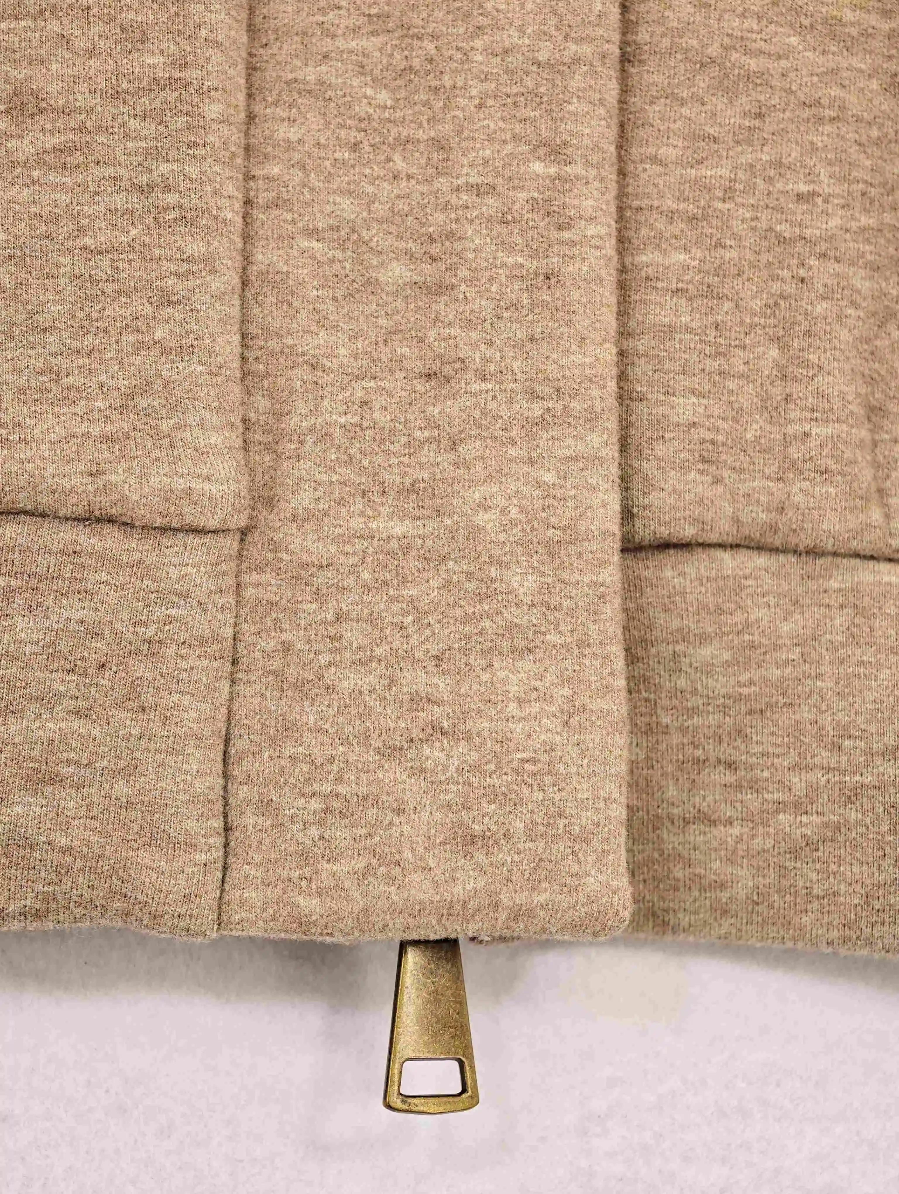 Concealed front placket and structured hem construction detail