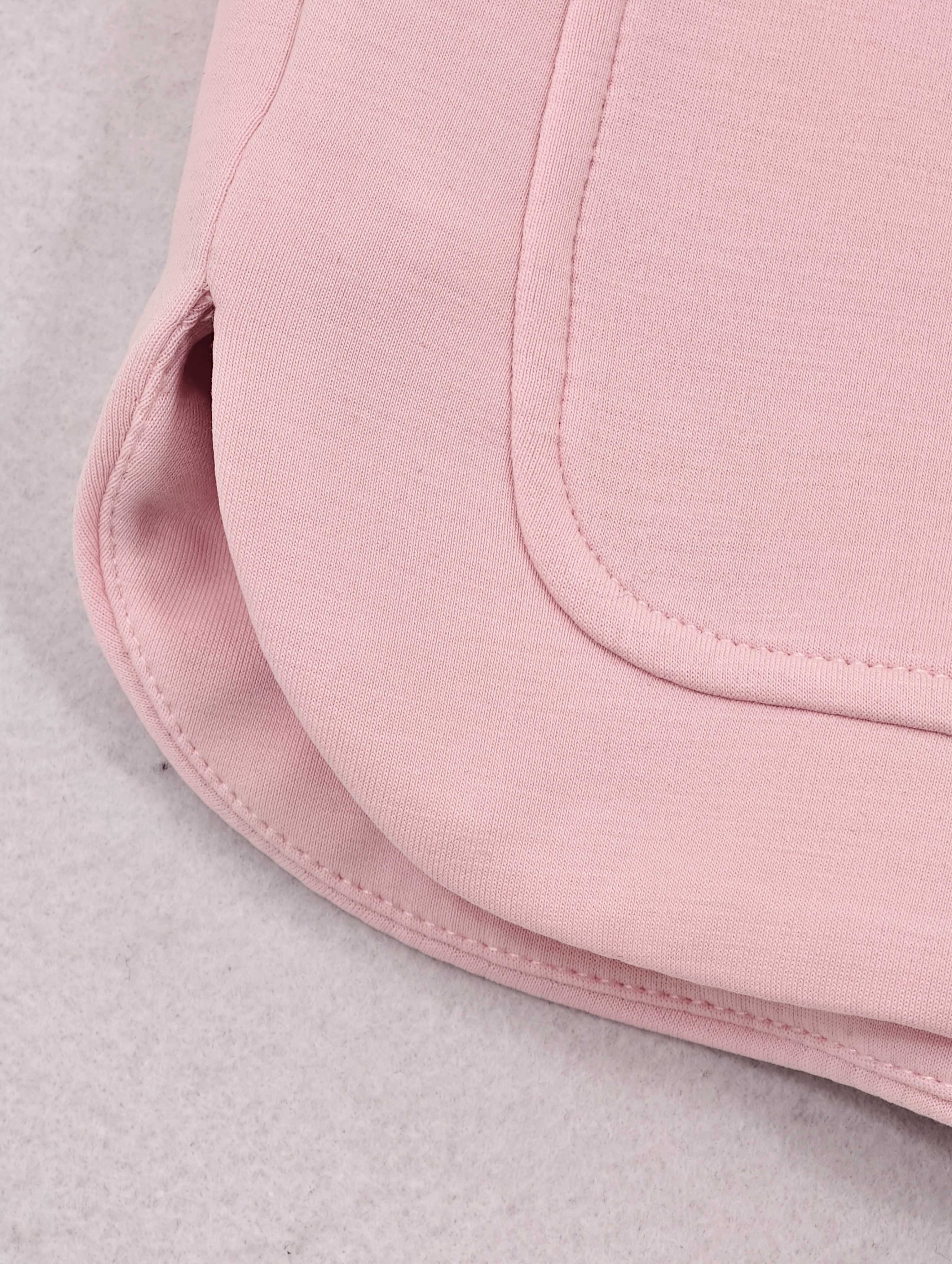 Curved side pocket and rounded hem construction