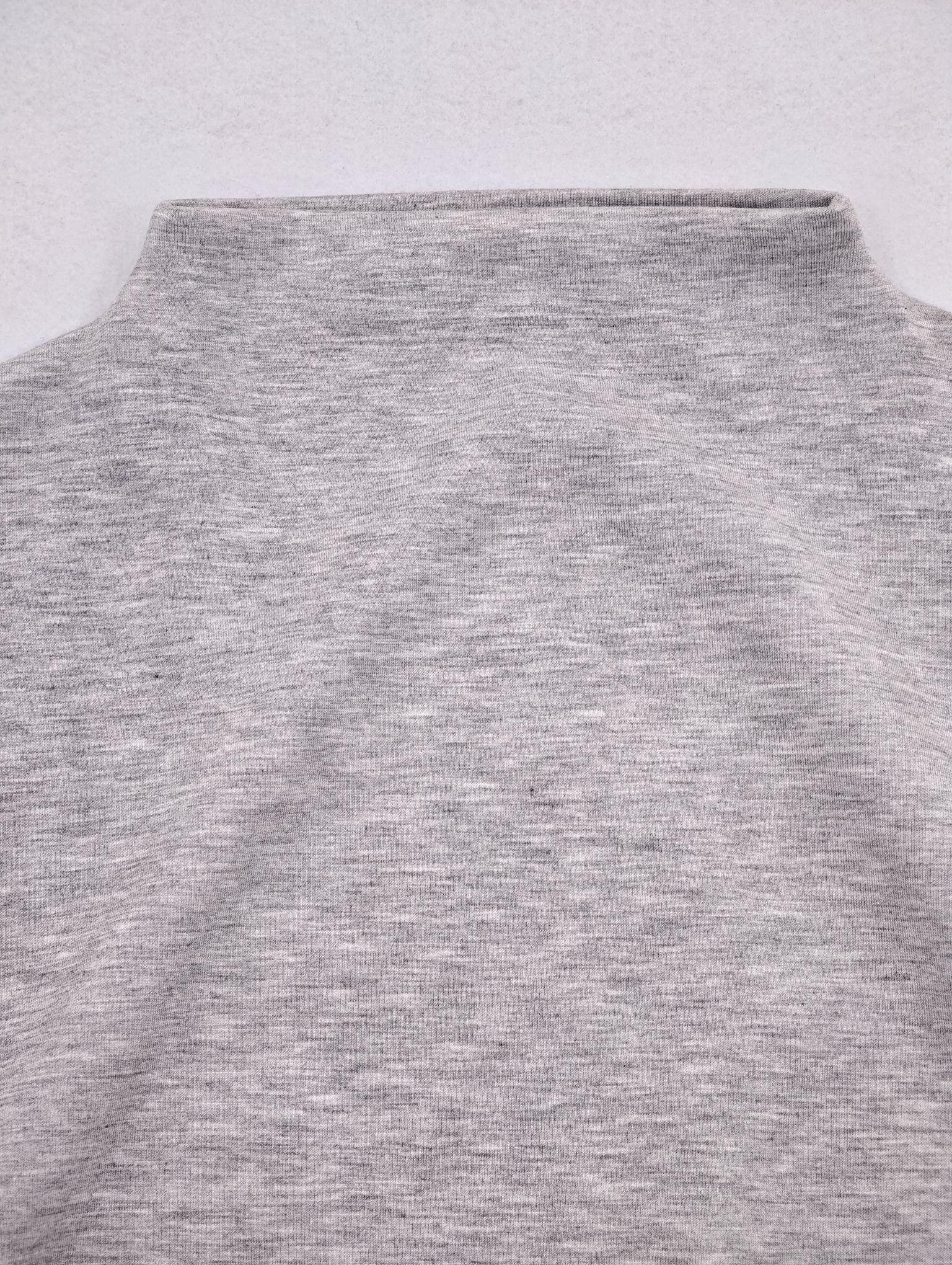 Mock neckline and shoulder seam on heather fabric