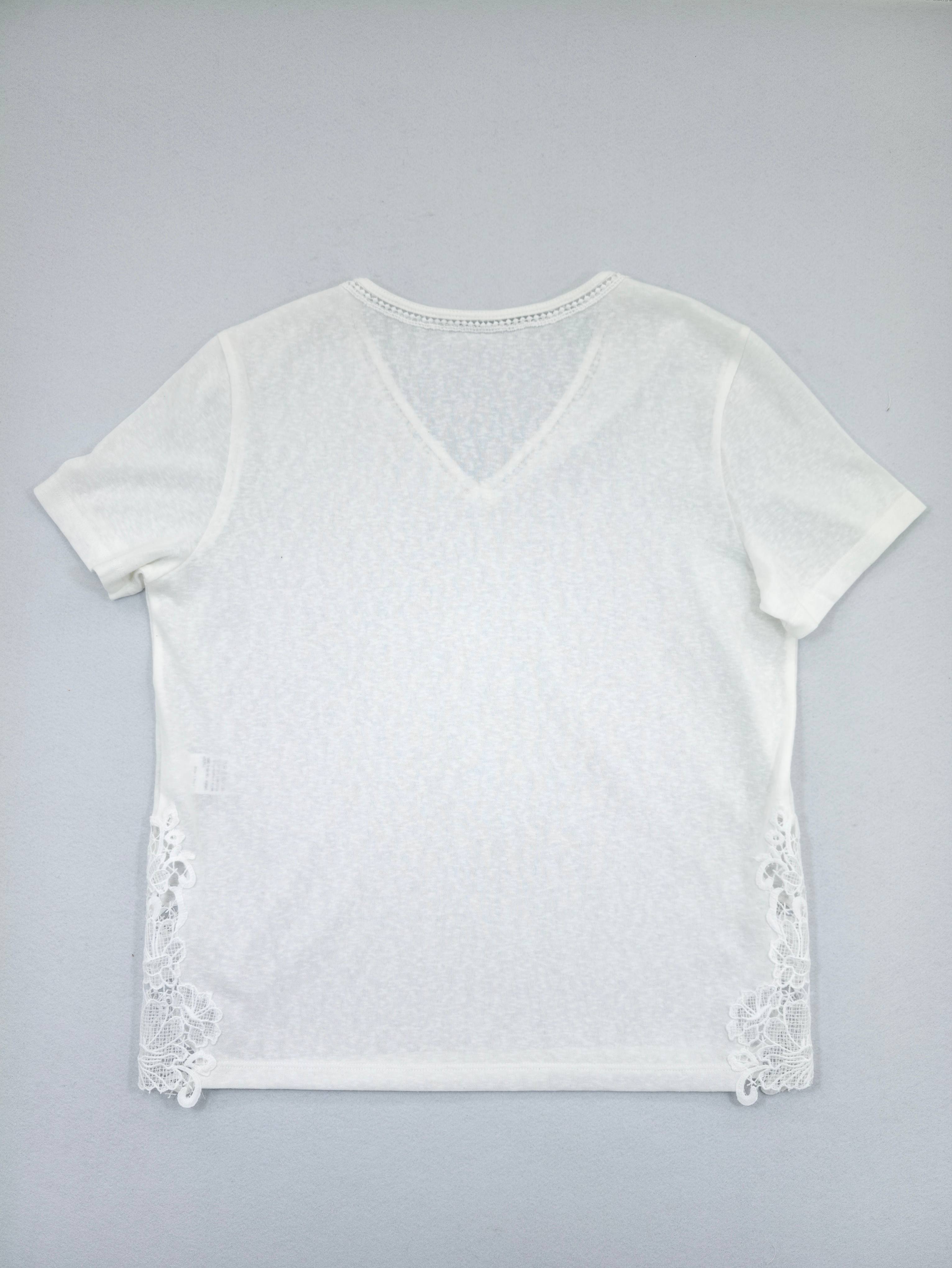 Back view showing relaxed fit and floral side inserts
