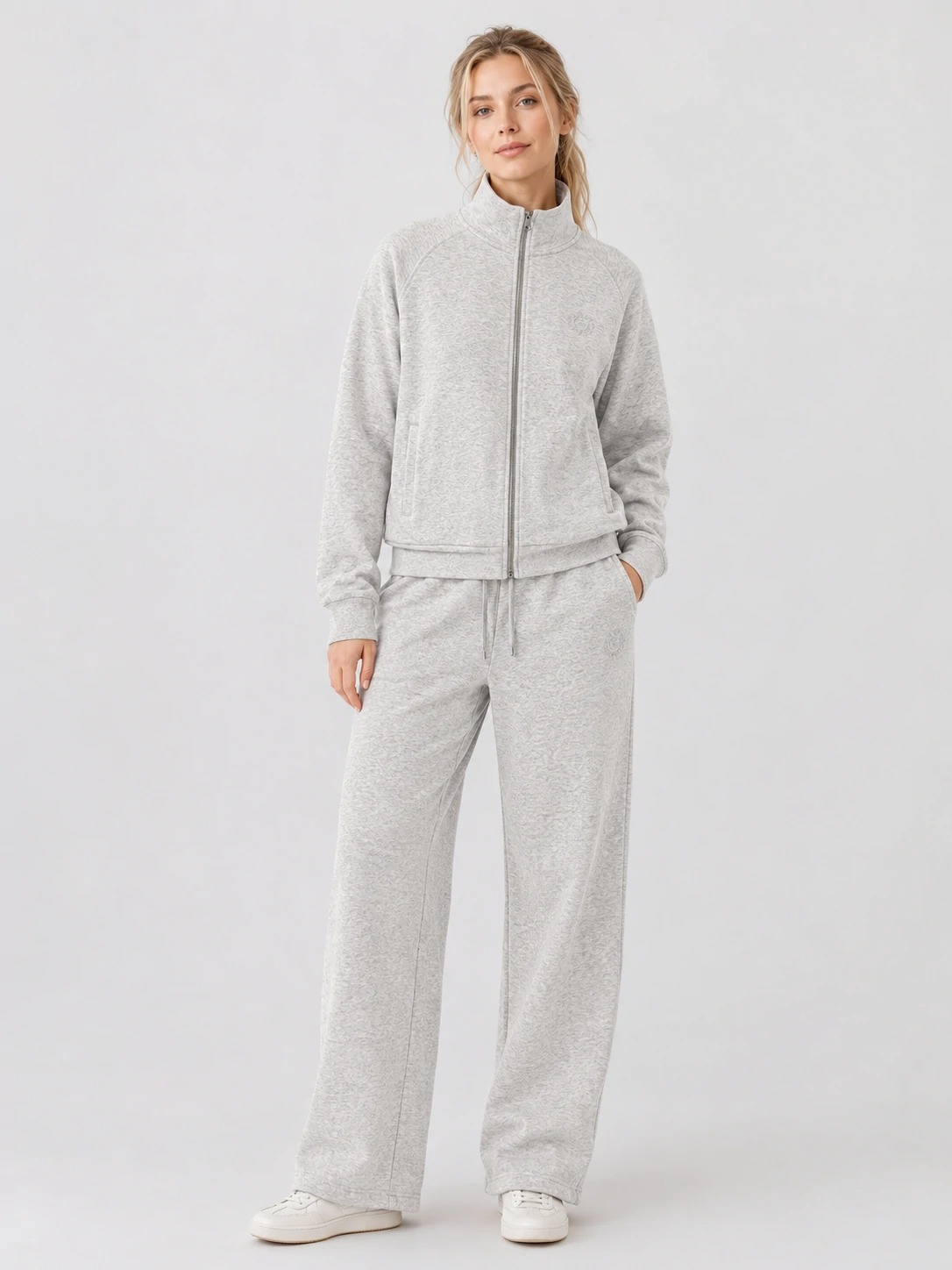 Model wearing light heather grey zip jacket and wide-leg pants