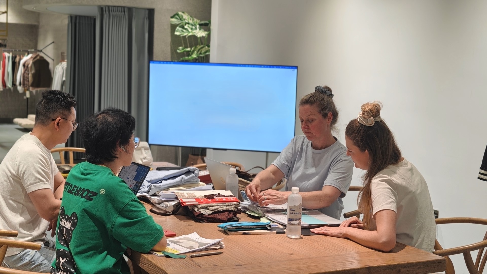 apparel sample development meeting with tech pack and garment samples