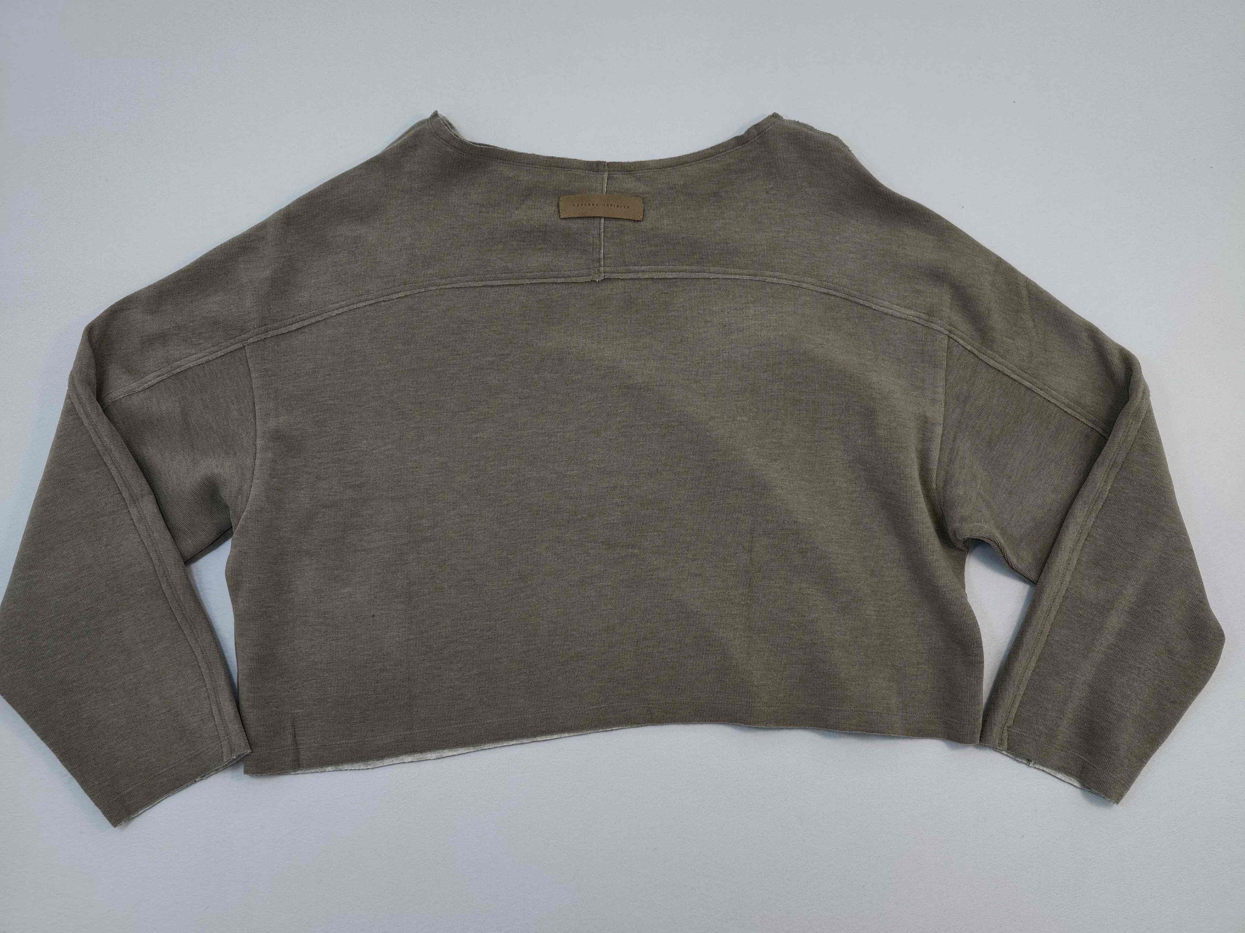 Relaxed cropped top back view with dropped shoulders