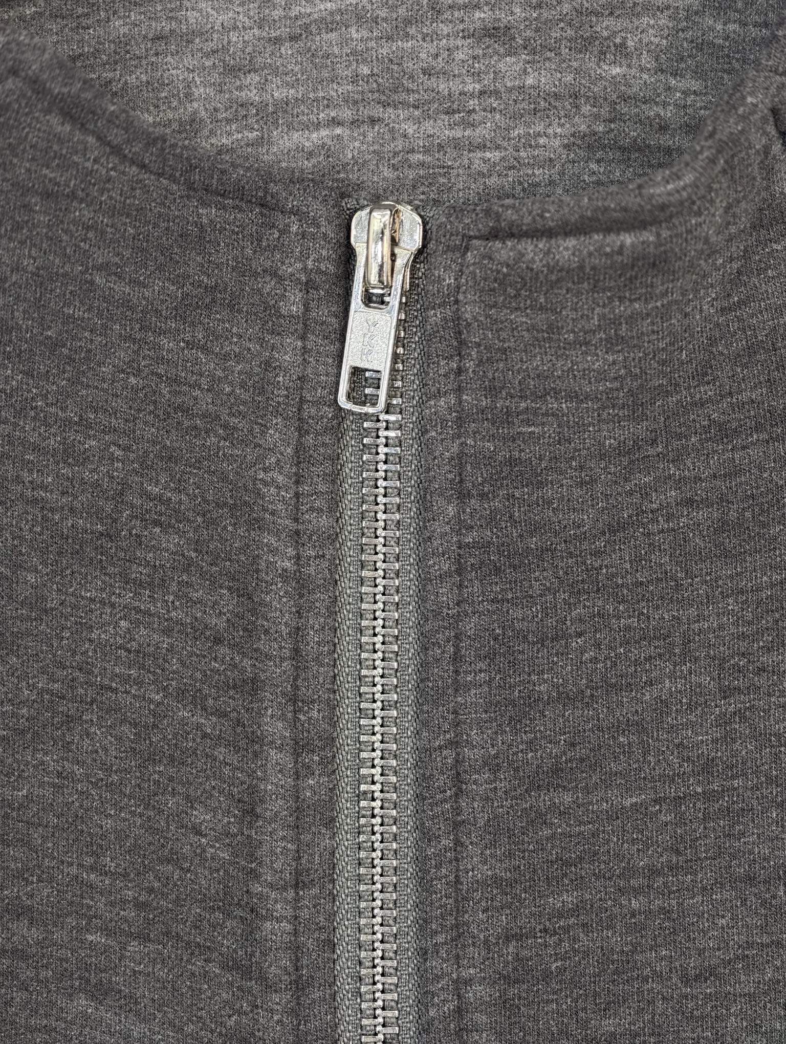 Metal zipper and acrylic fleece texture close-up