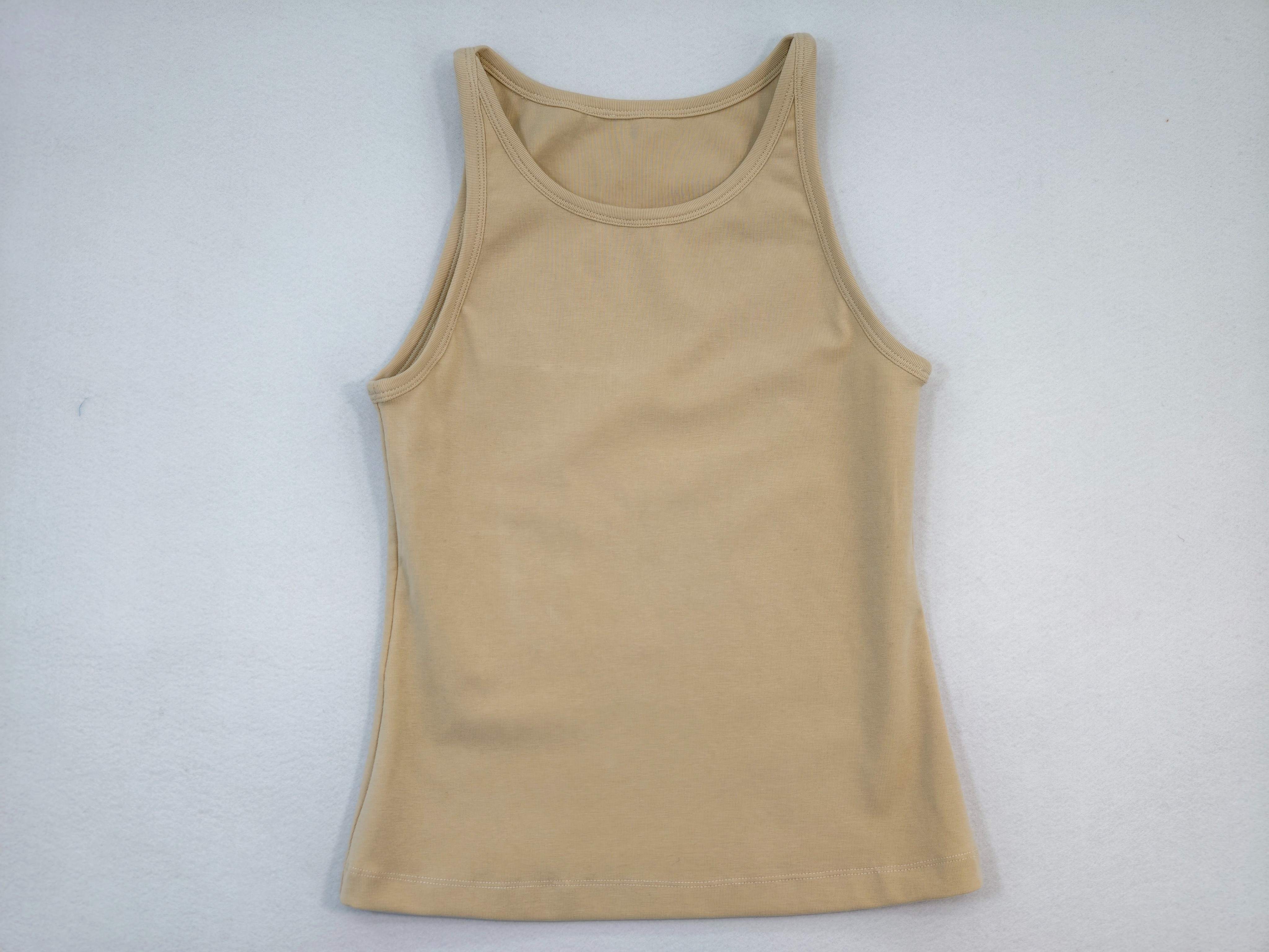 Beige sleeveless tank with self-bound neckline and armholes