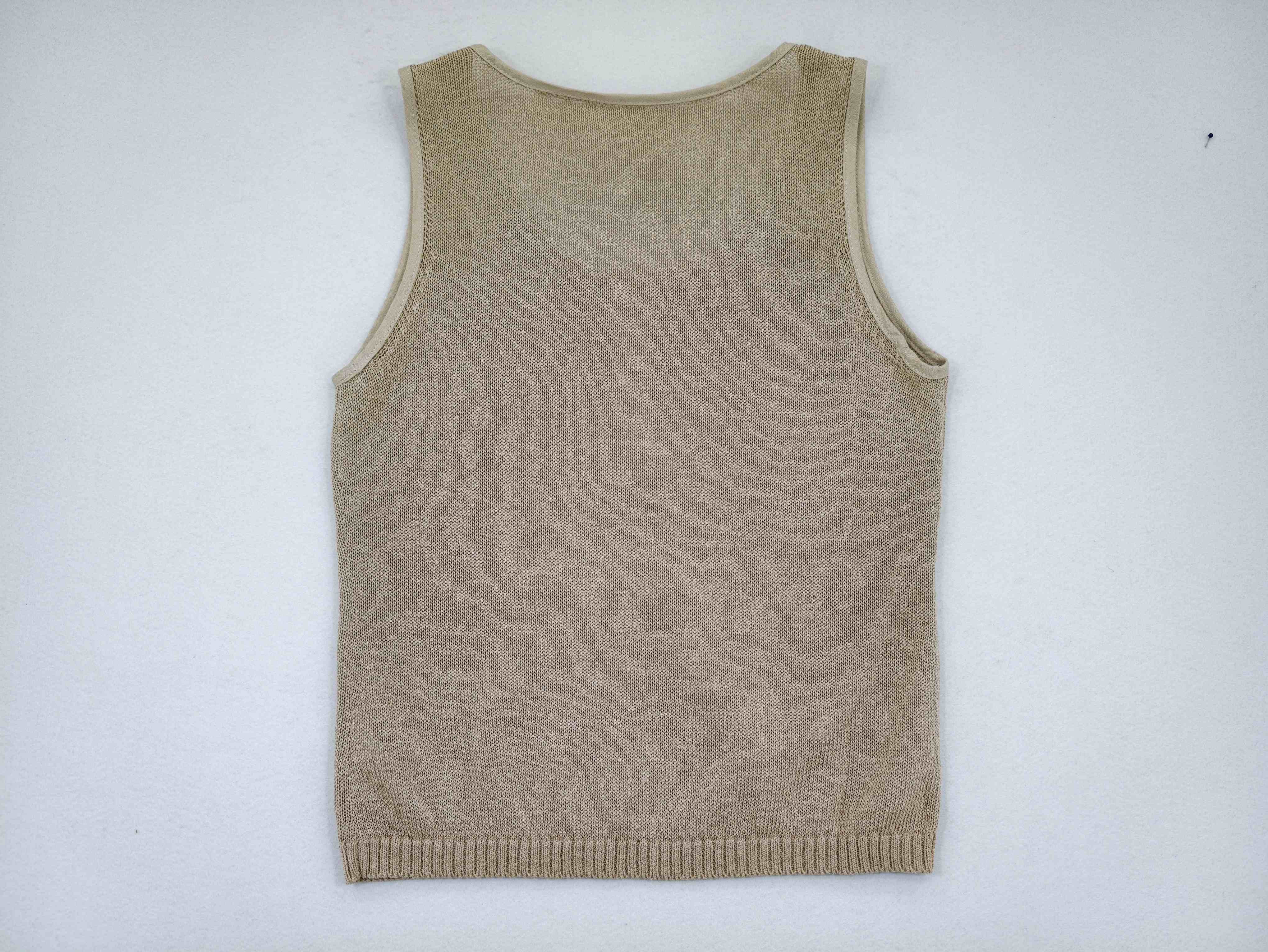 Back view of an OEM women’s sleeveless knit tank with a ribbed hem