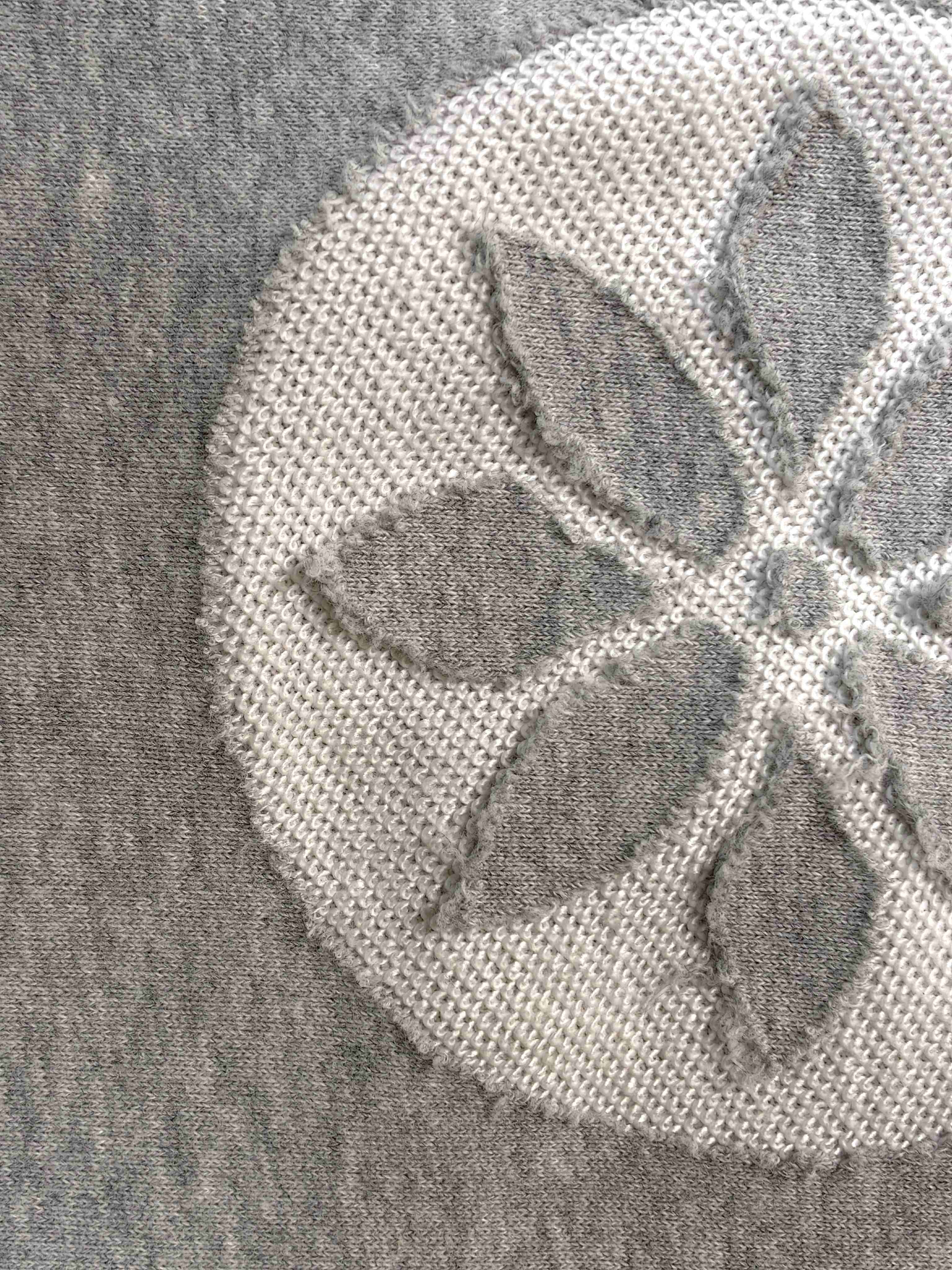Close-up of laser burn-out floral pattern and bonded backing