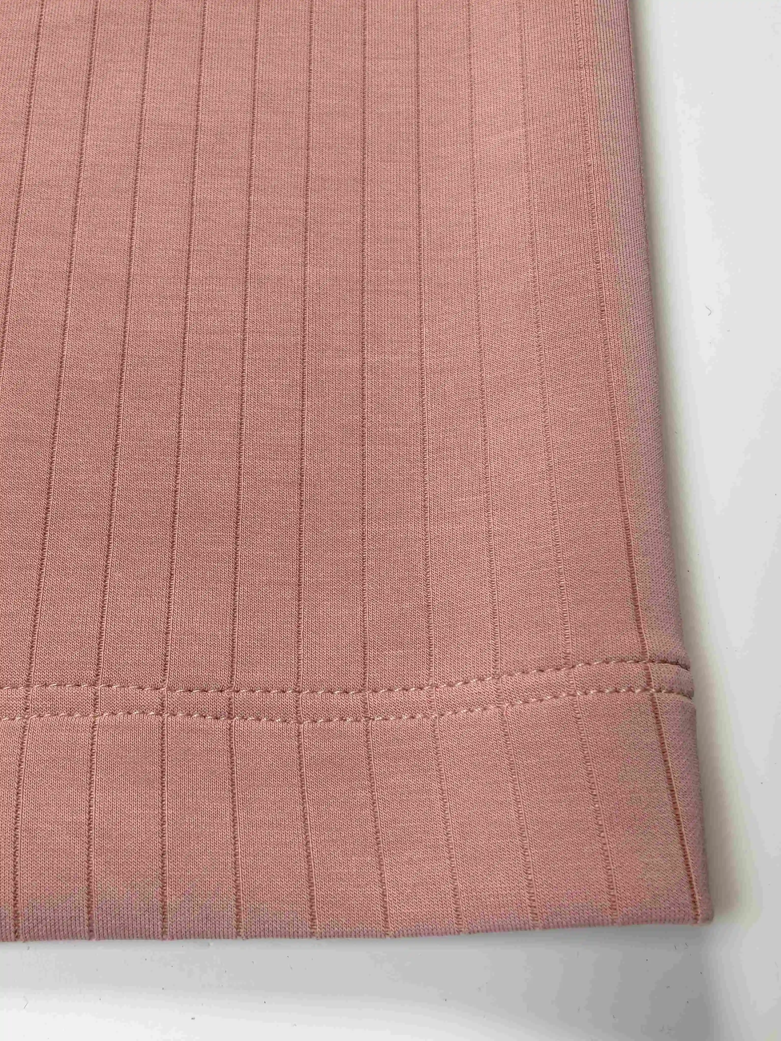 Wide-leg hem and textured knit surface close-up