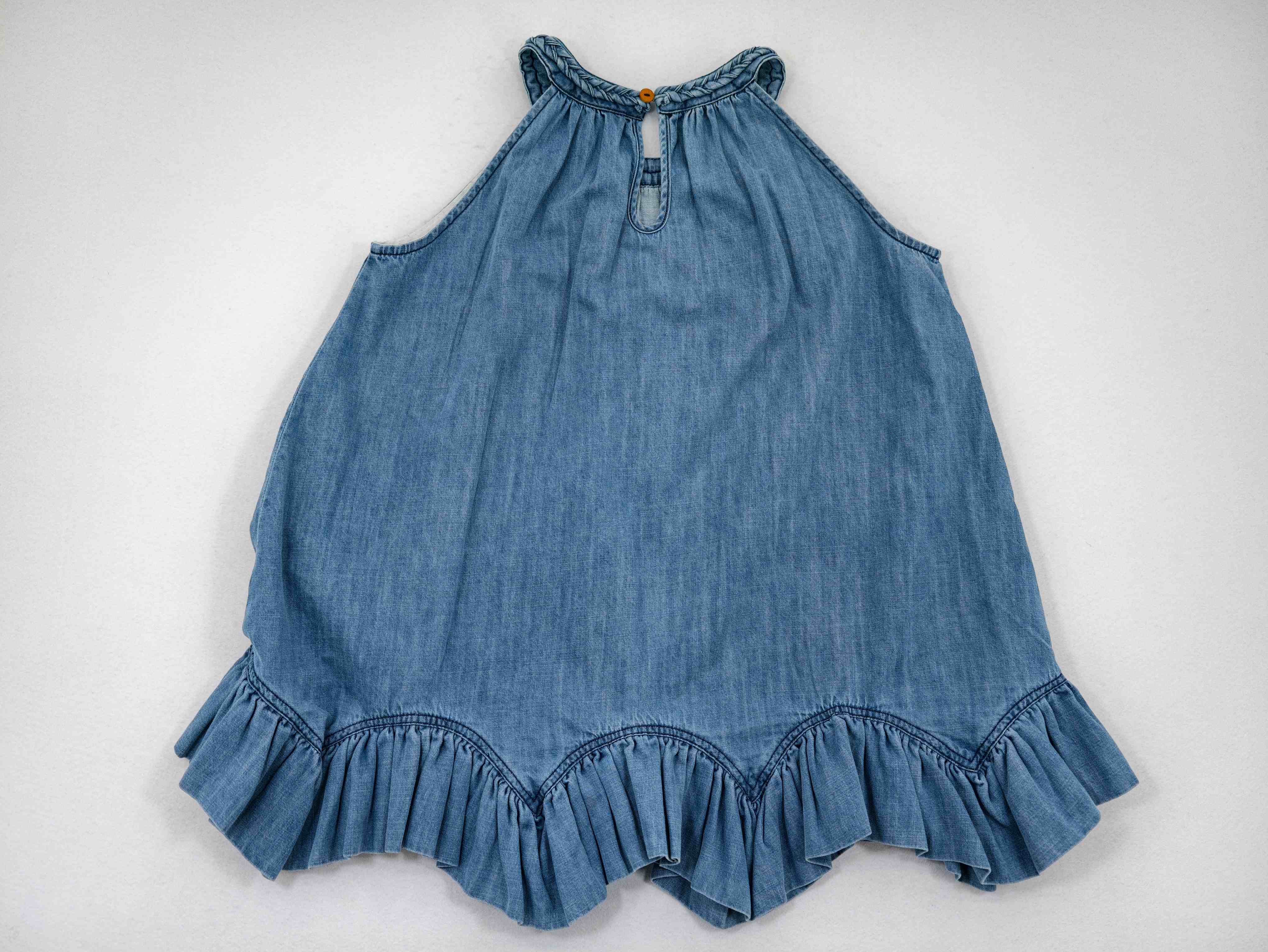Back view with gathered neckline and keyhole button closure