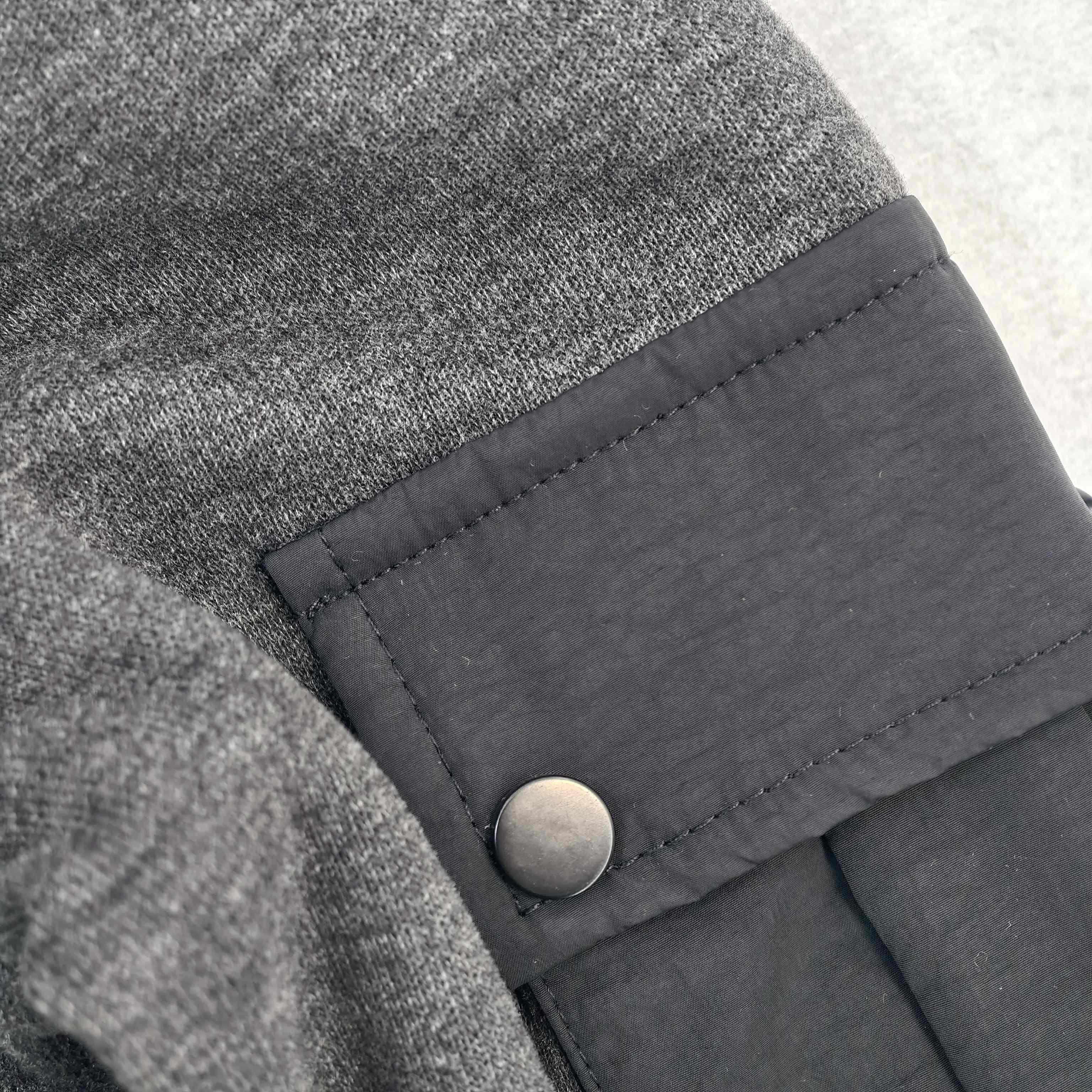 Woven nylon sleeve pocket with snap fastening detail