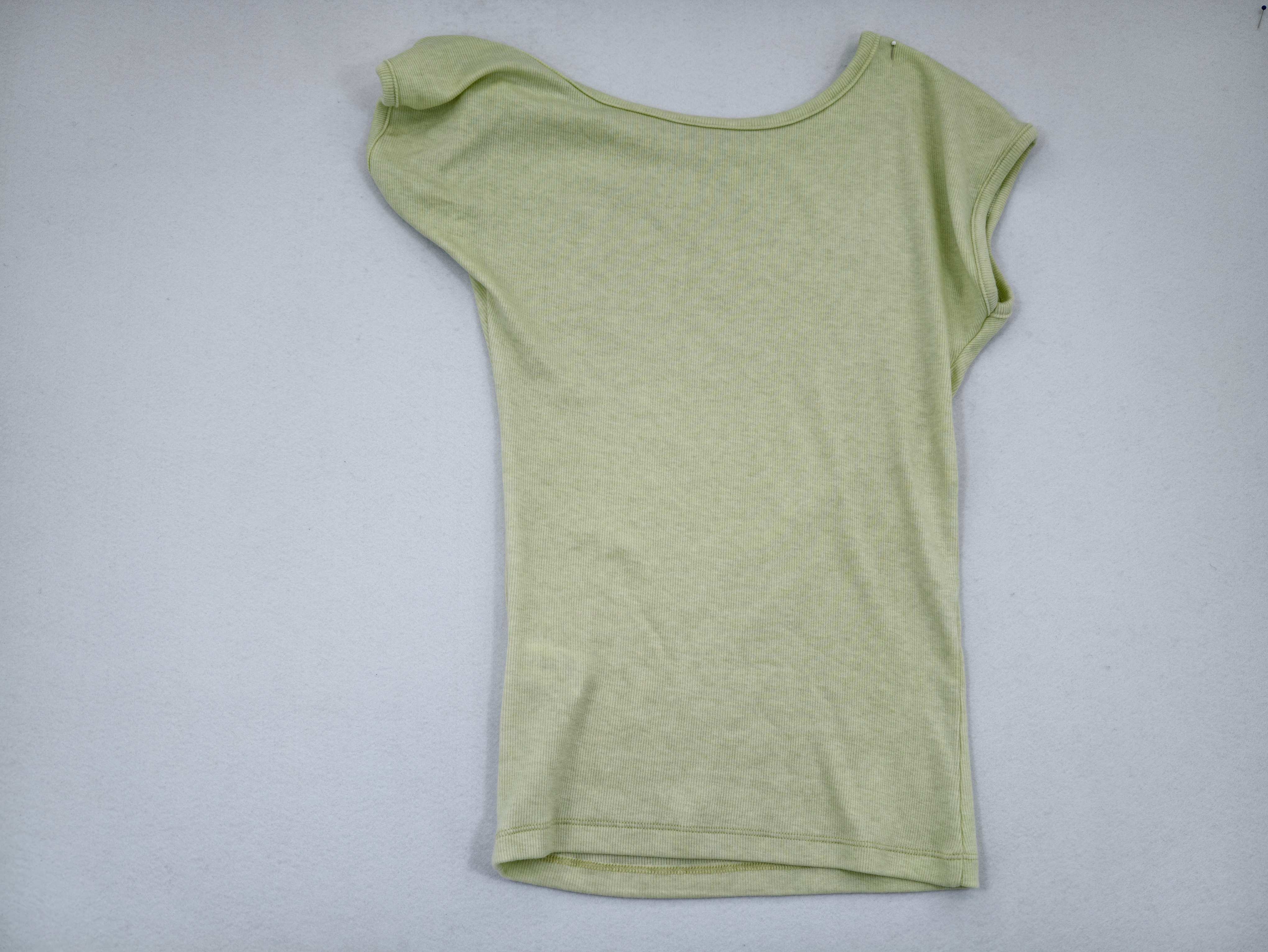 Back view showing single cap sleeve and fitted silhouette