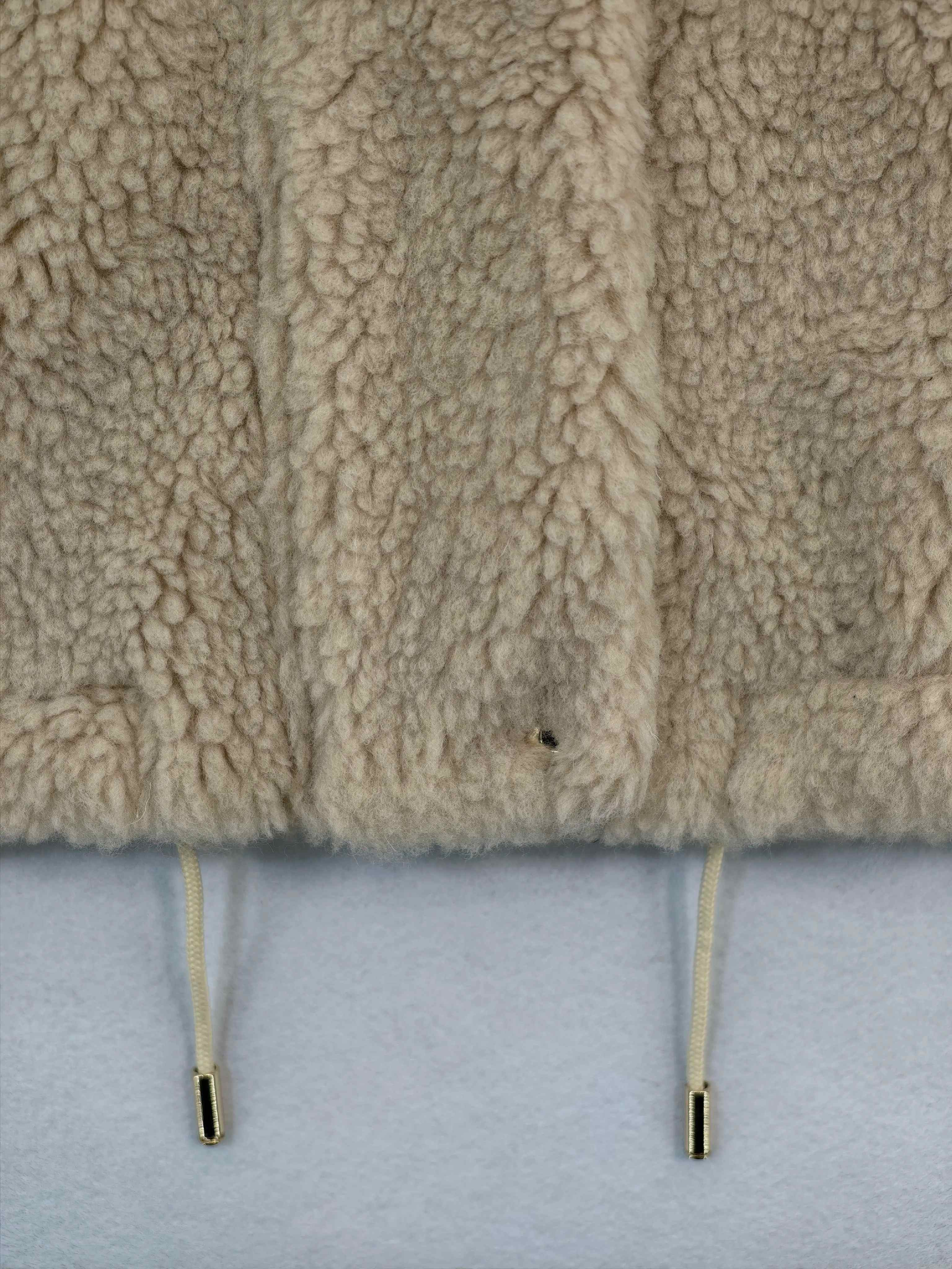 Adjustable drawcord hem on custom Sherpa layering vest