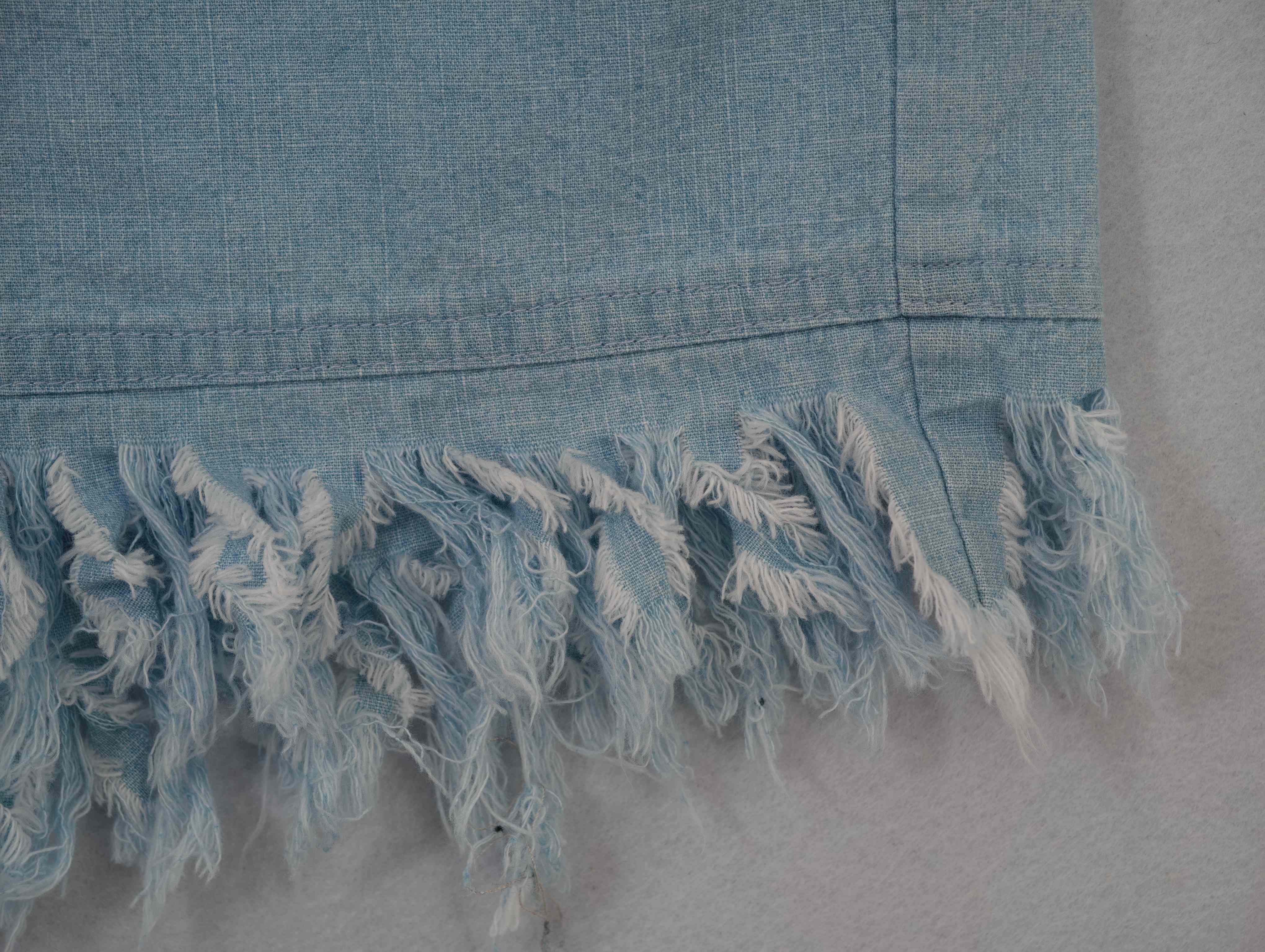 Reinforced tassel hem construction