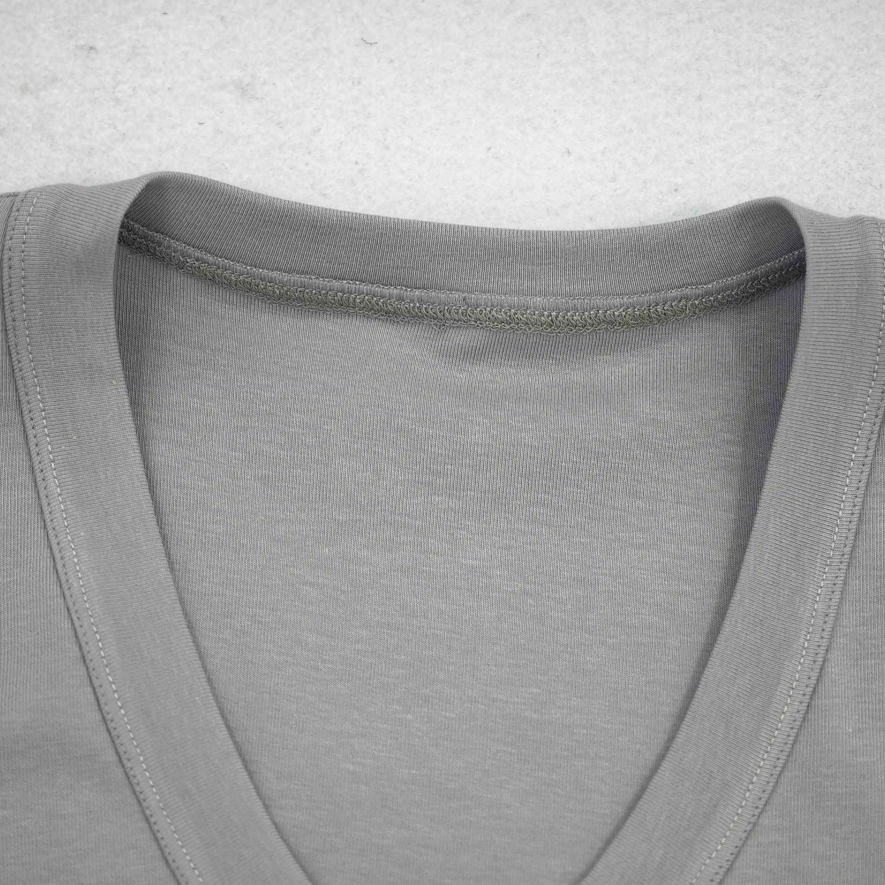 V-neck binding and shoulder seam construction close-up