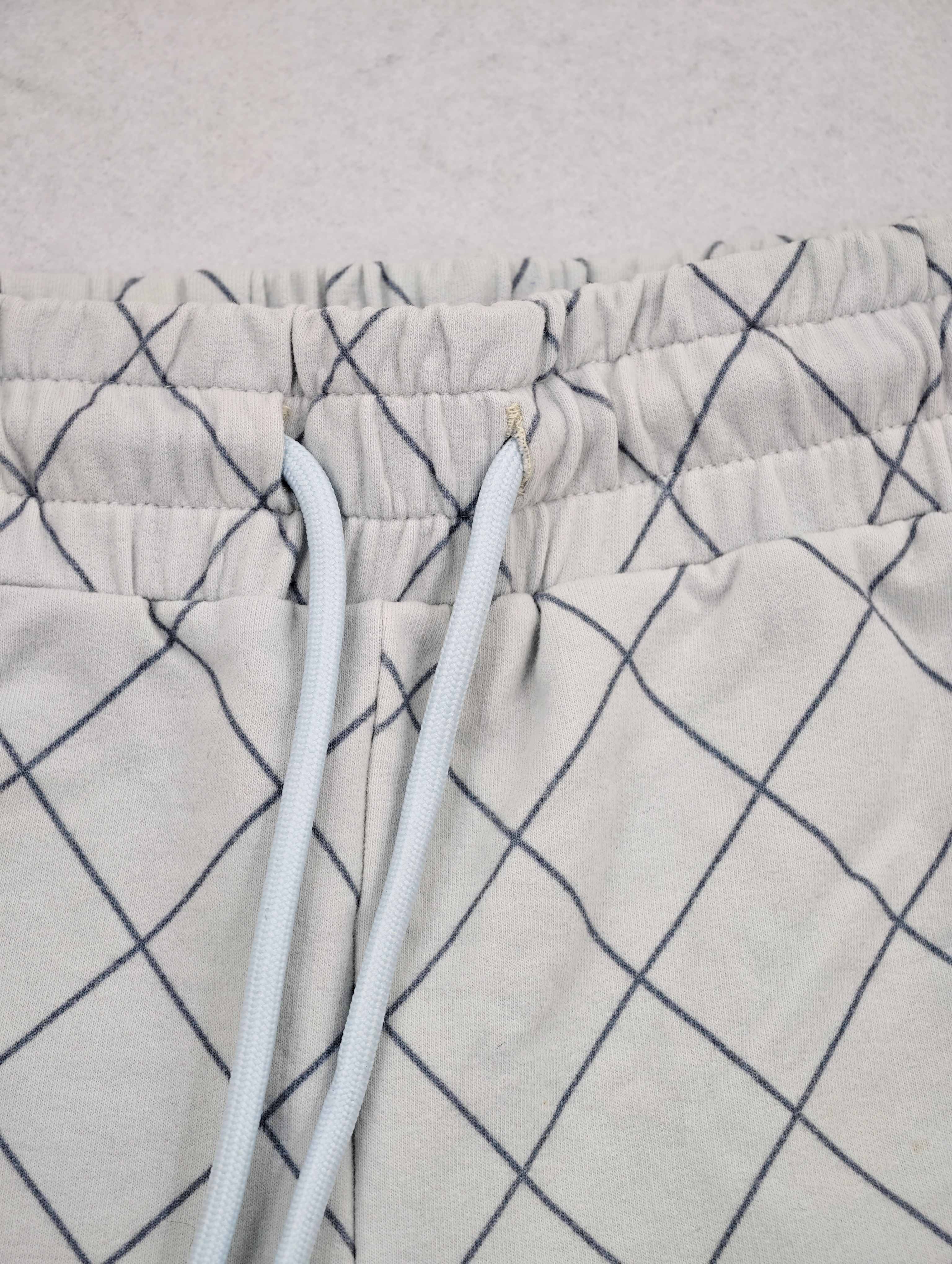 Elastic waistband with matching adjustable drawcord