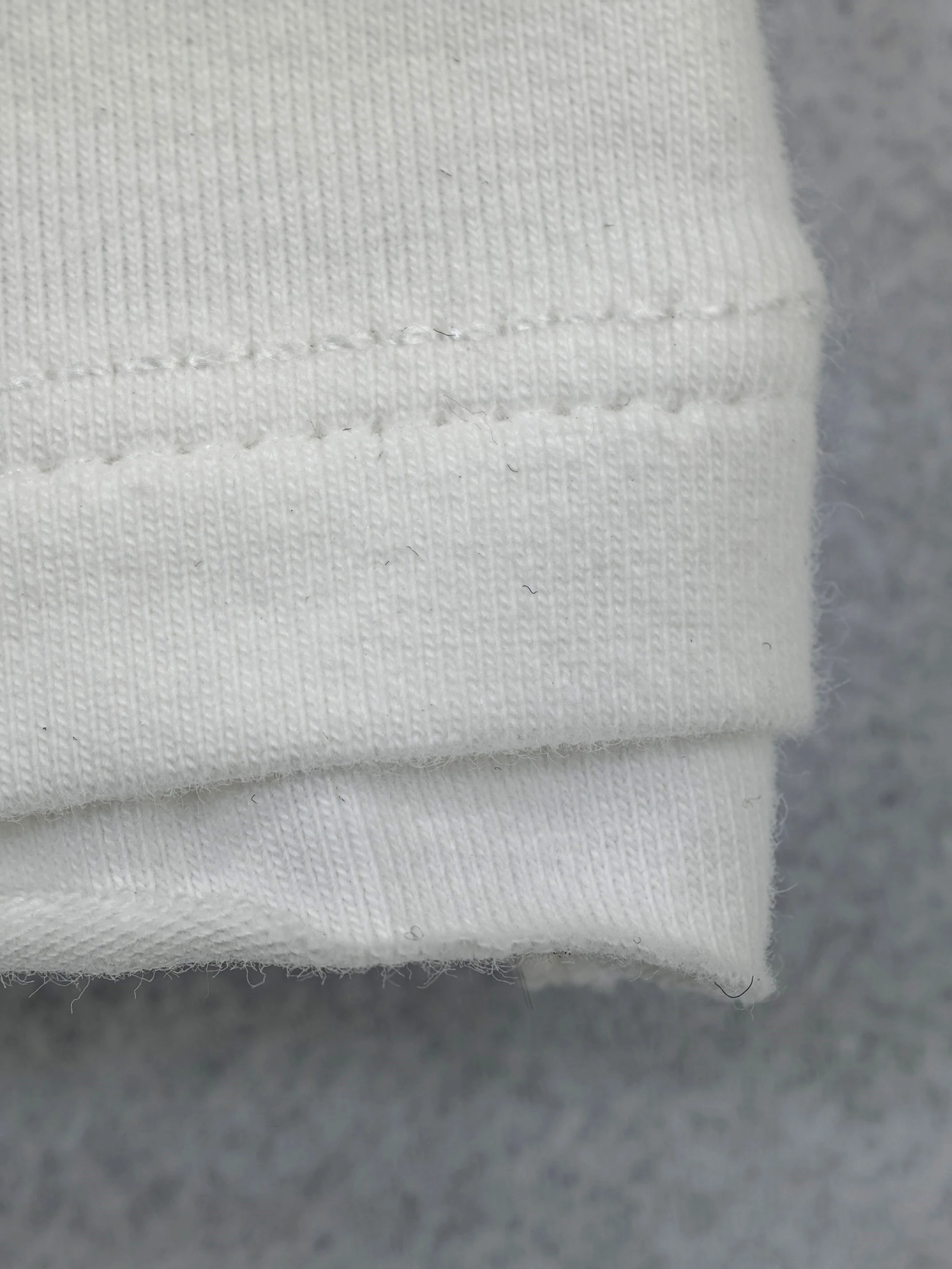 195 GSM fabric with twin-needle hem construction