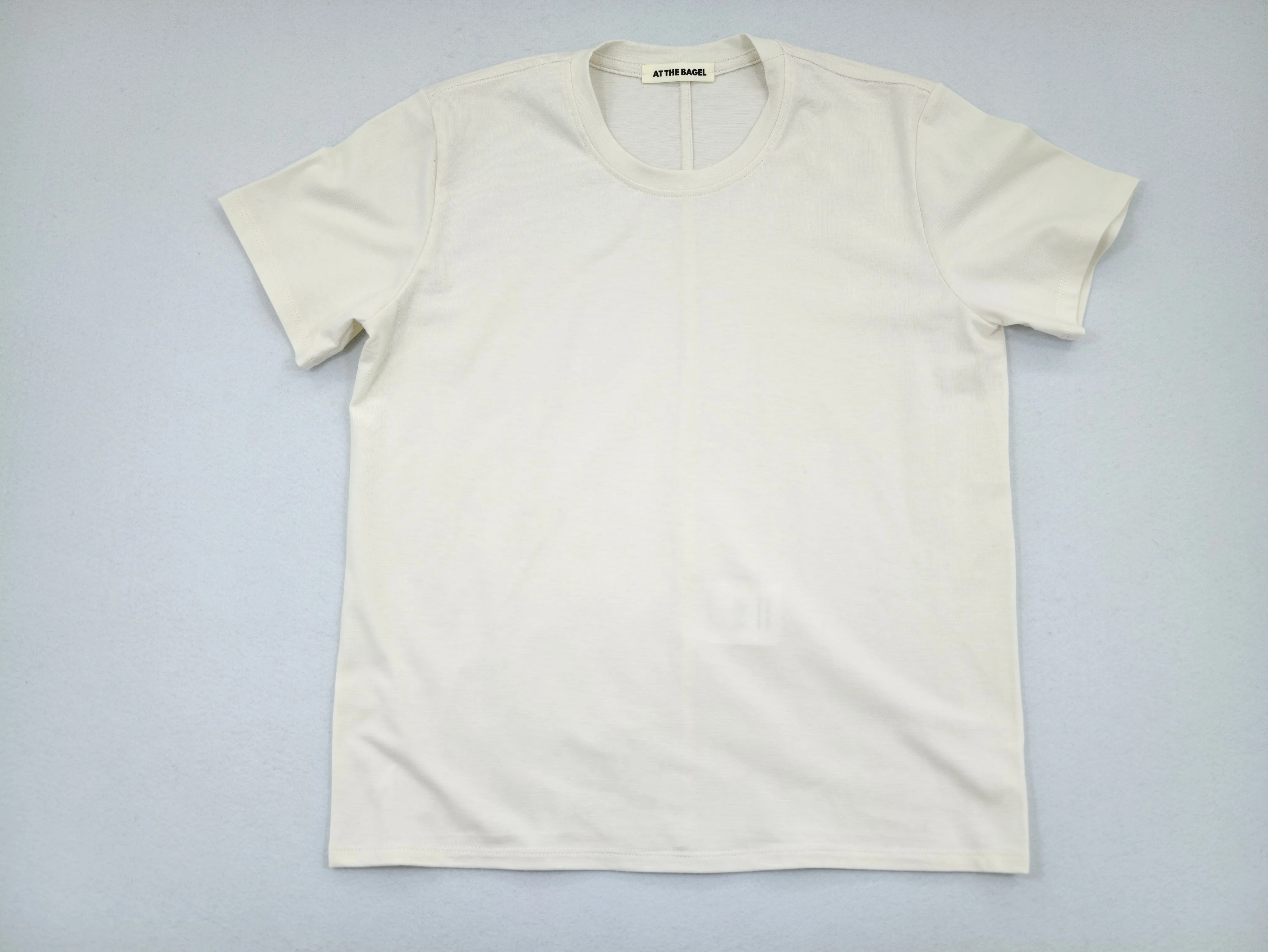 Ivory peach-brushed jersey T-shirt laid flat from front