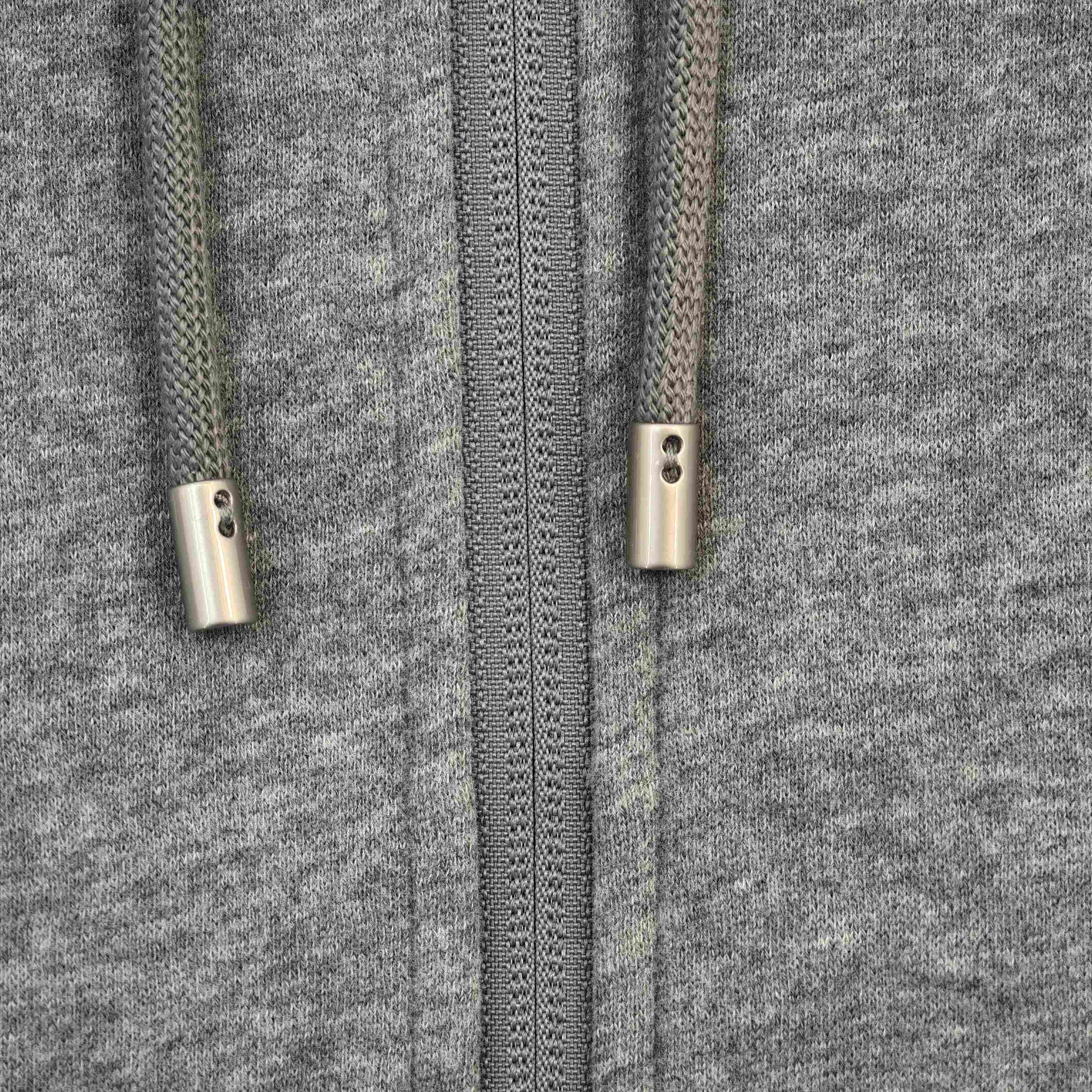 Metal drawcord tips and front zipper detail