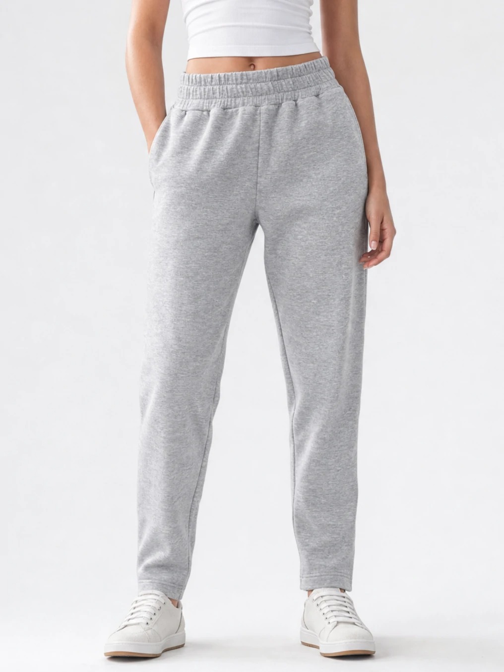 Model wearing heather grey tapered jogger pants