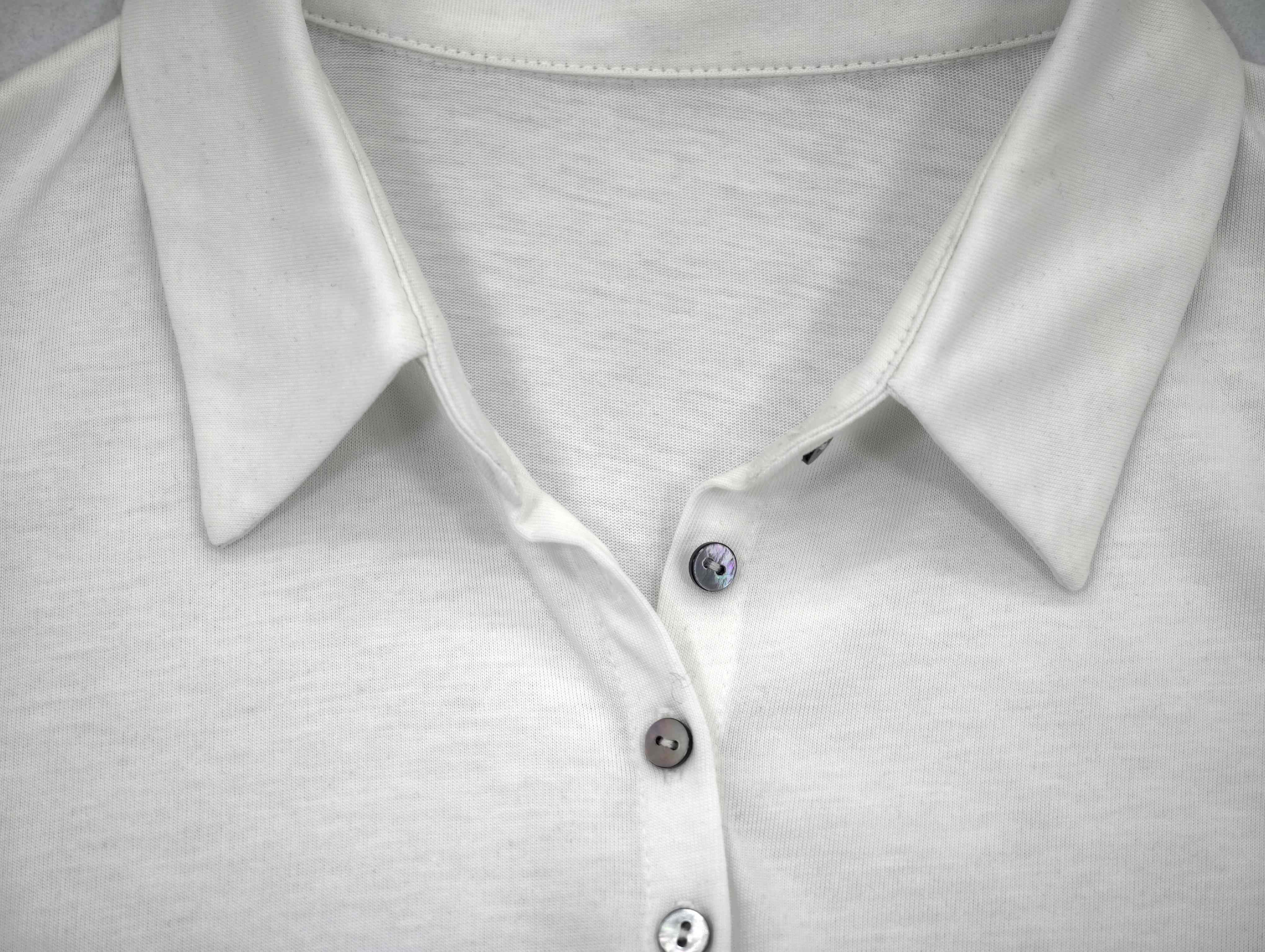 Point collar and button placket construction close-up