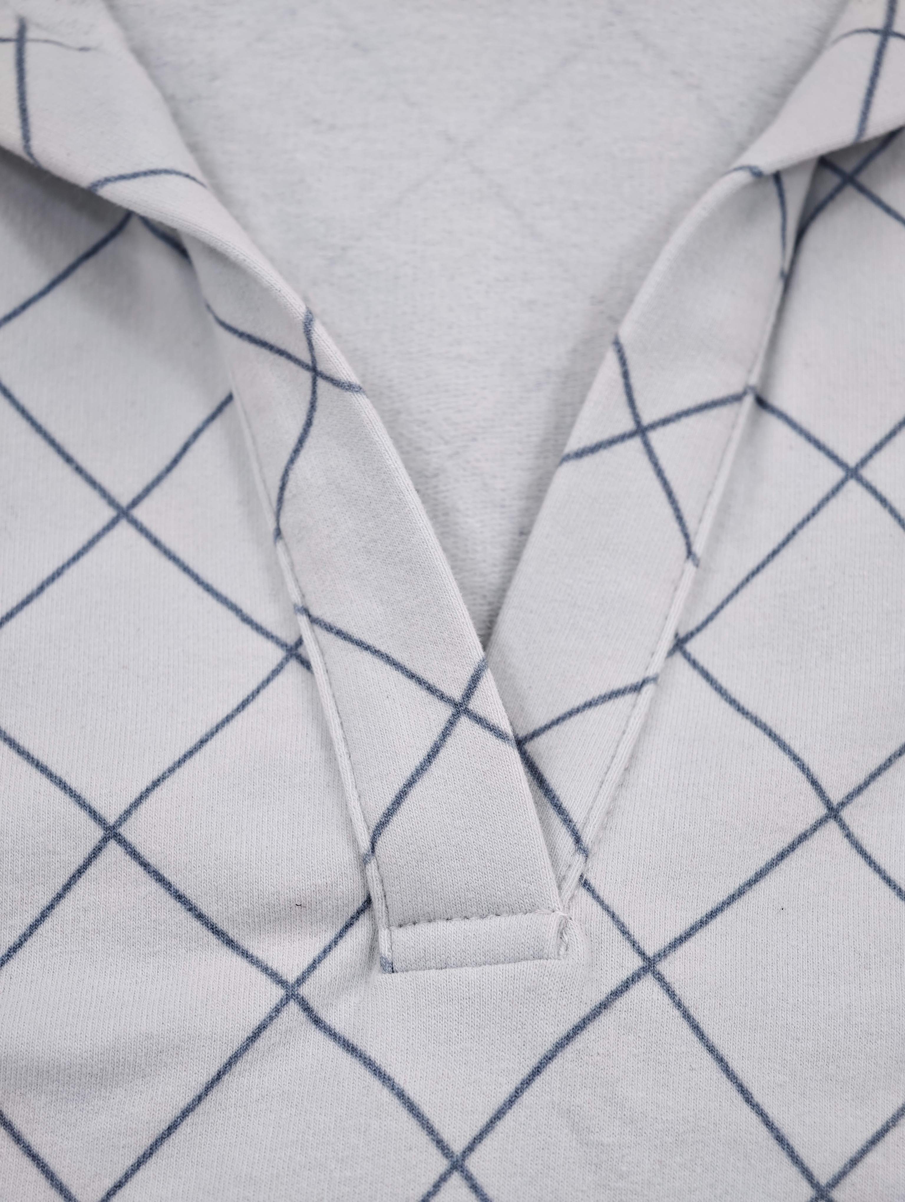 Open V-neck placket and pointed collar detail