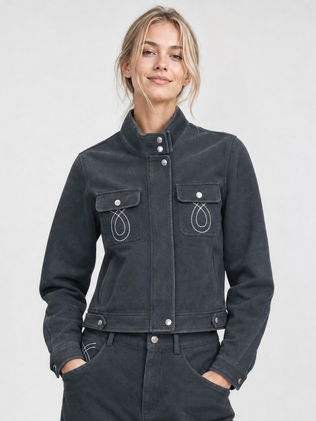 Woman wearing dark denim style cropped jacket