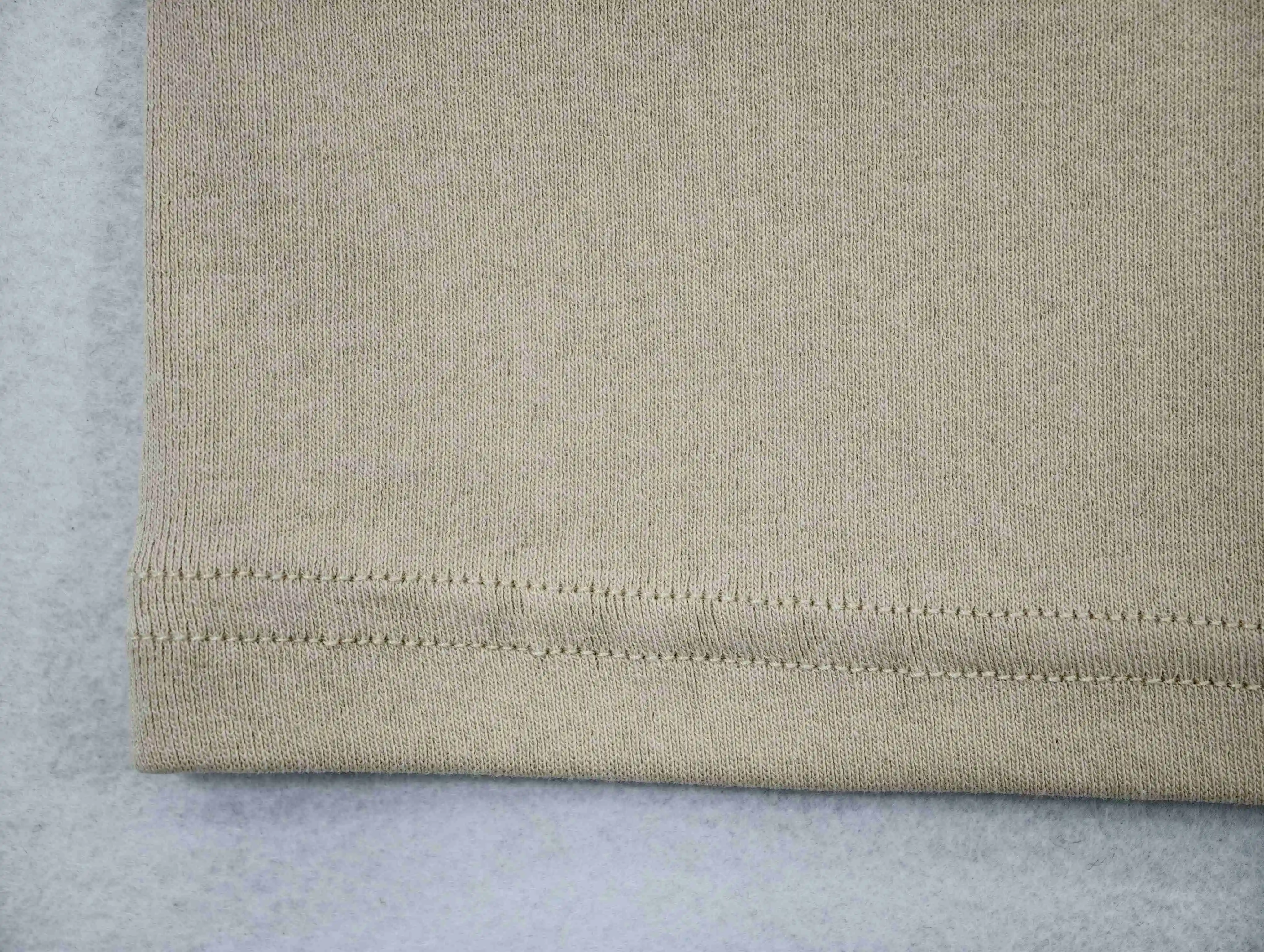 Fine 1×1 rib texture with twin-needle hem