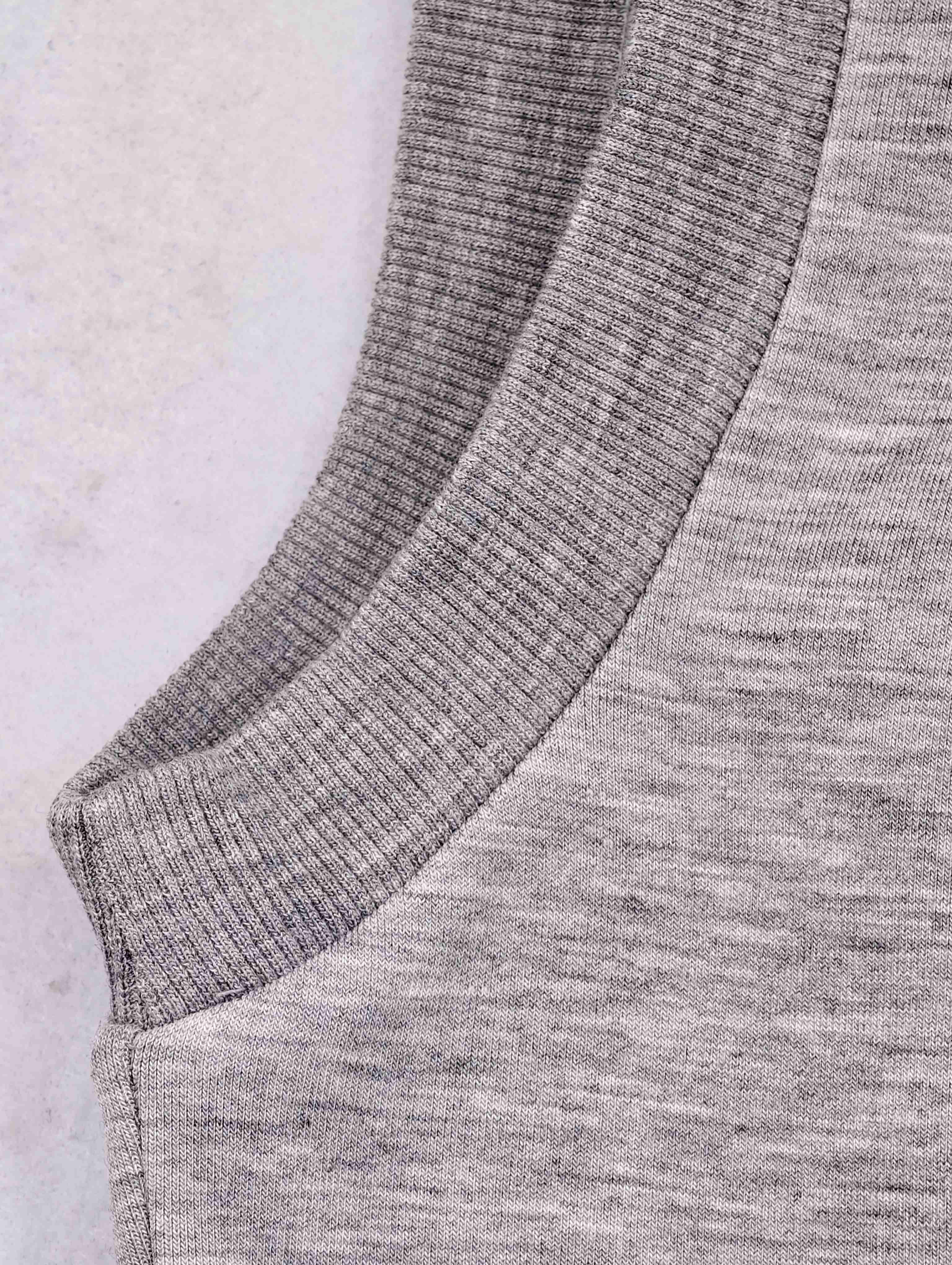 Sleeveless armhole with textured rib trim