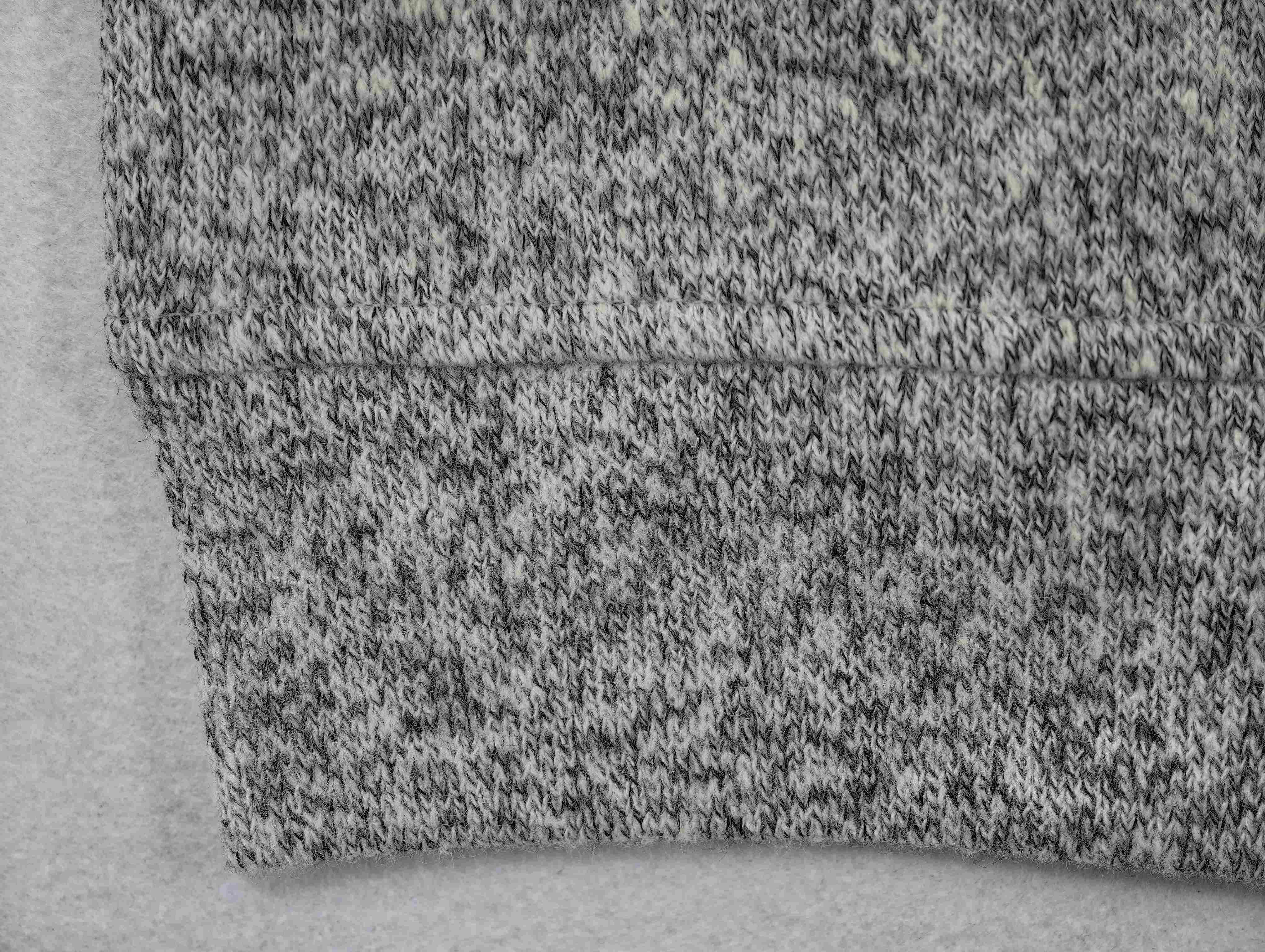 Mélange knit texture and seam stitching detail