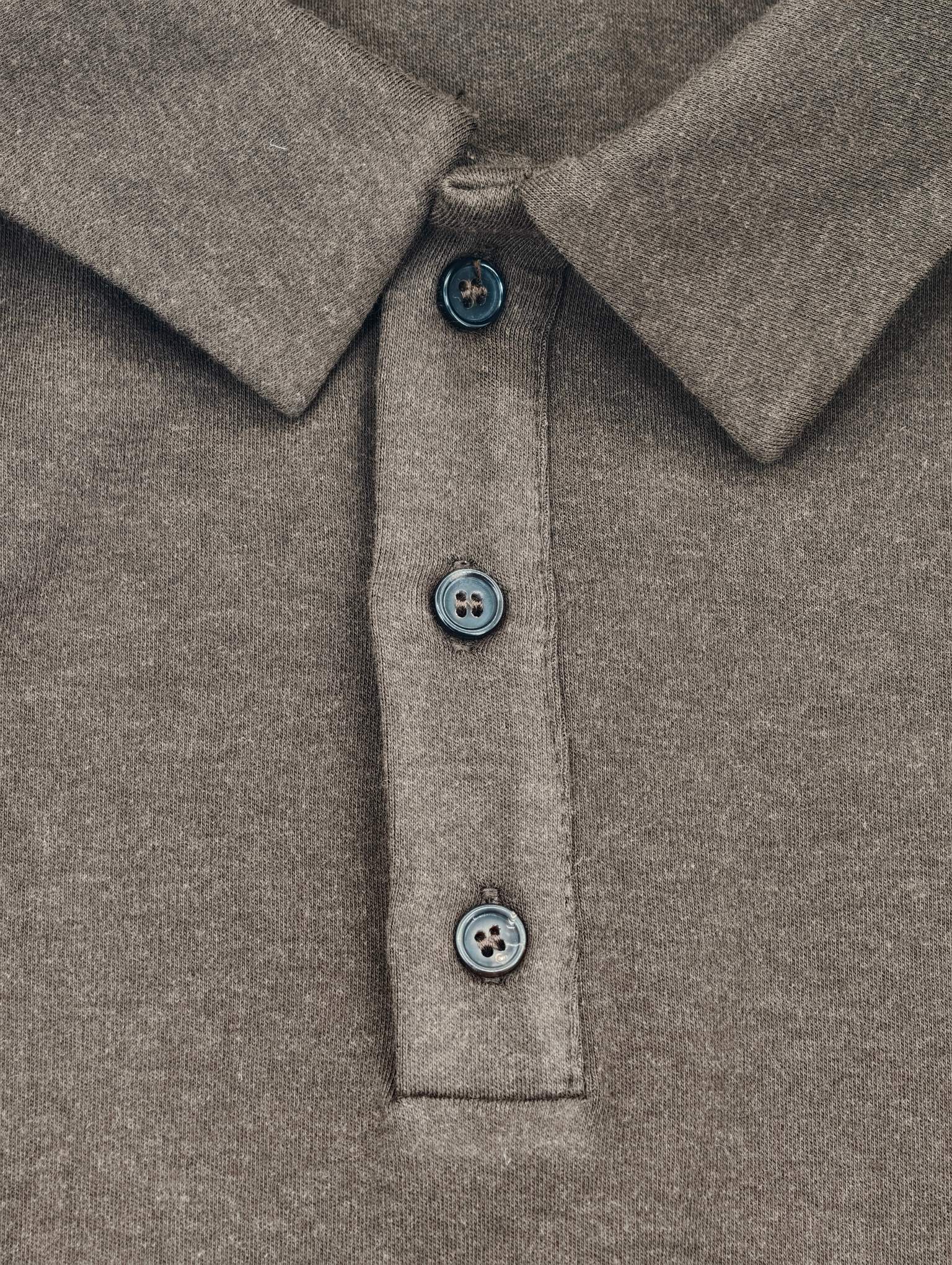 Three-button placket with structured soft-knit polo collar