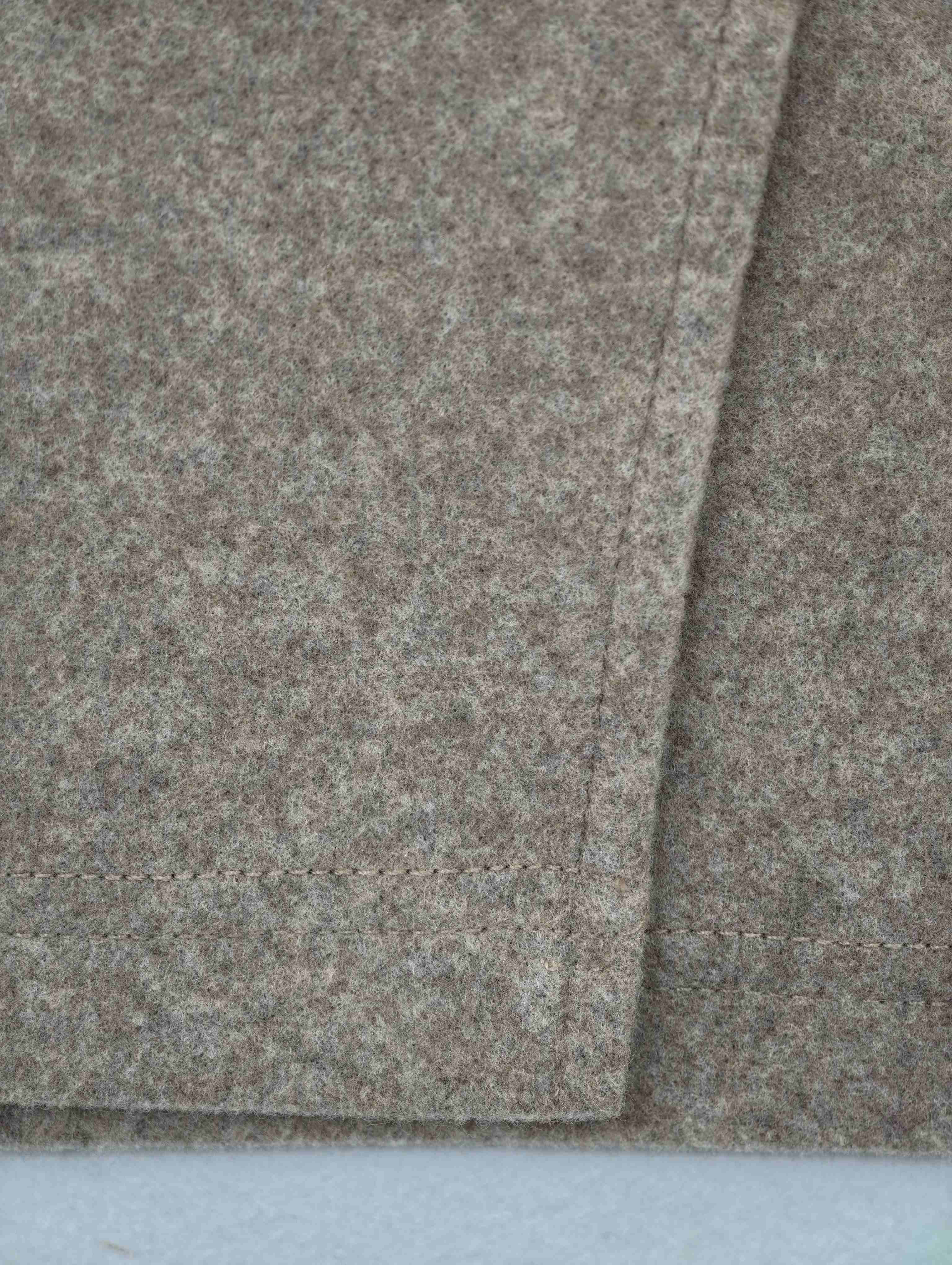 Textured wool-blend fabric with clean seam finish