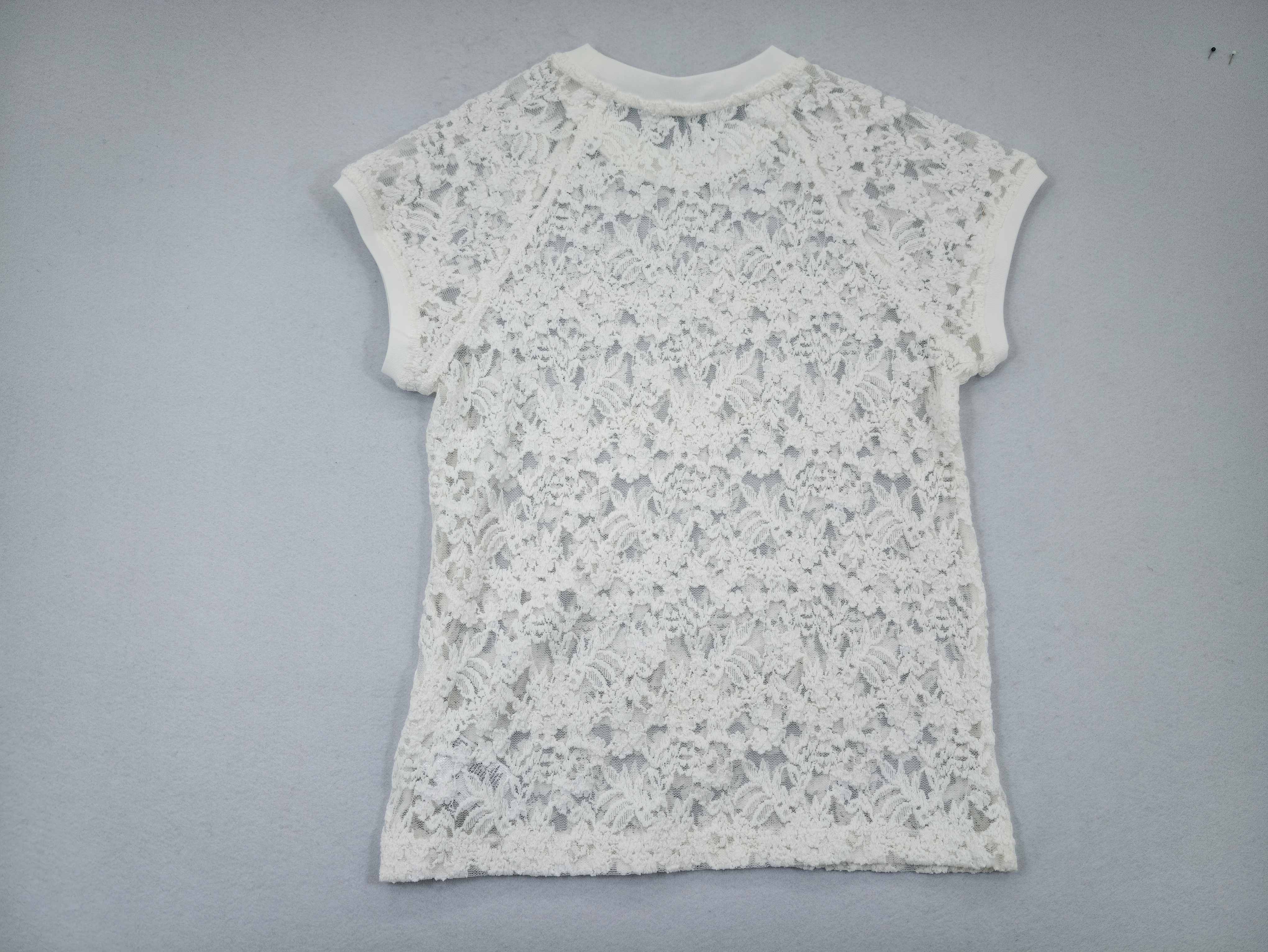 Back view of semi-sheer floral lace casual top