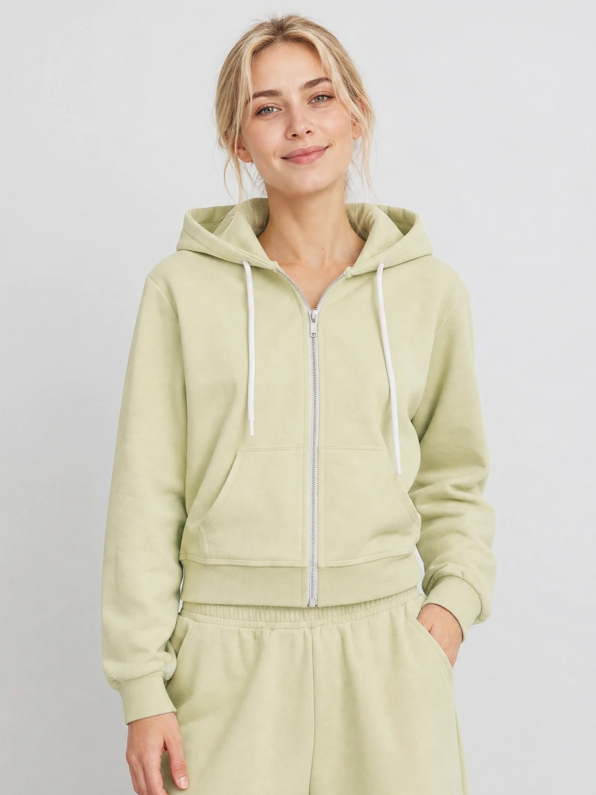 Women wearing pistachio cropped modal zip hoodie